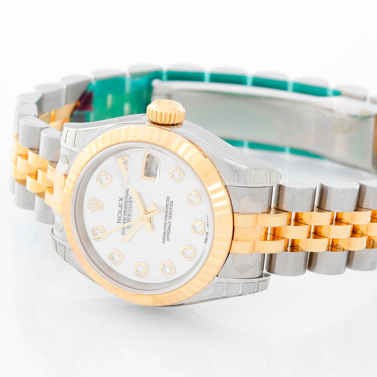Rolex  Datejust Ladies 2-Tone Diamond Watch Mother of Pearl Dial 179173 - Automatic winding, Quickset, 31 jewels, sapphire crystal. Stainless steel case with 18k yellow gold fluted bezel (26mm diameter). Factory Mother of Pearl diamond dial.