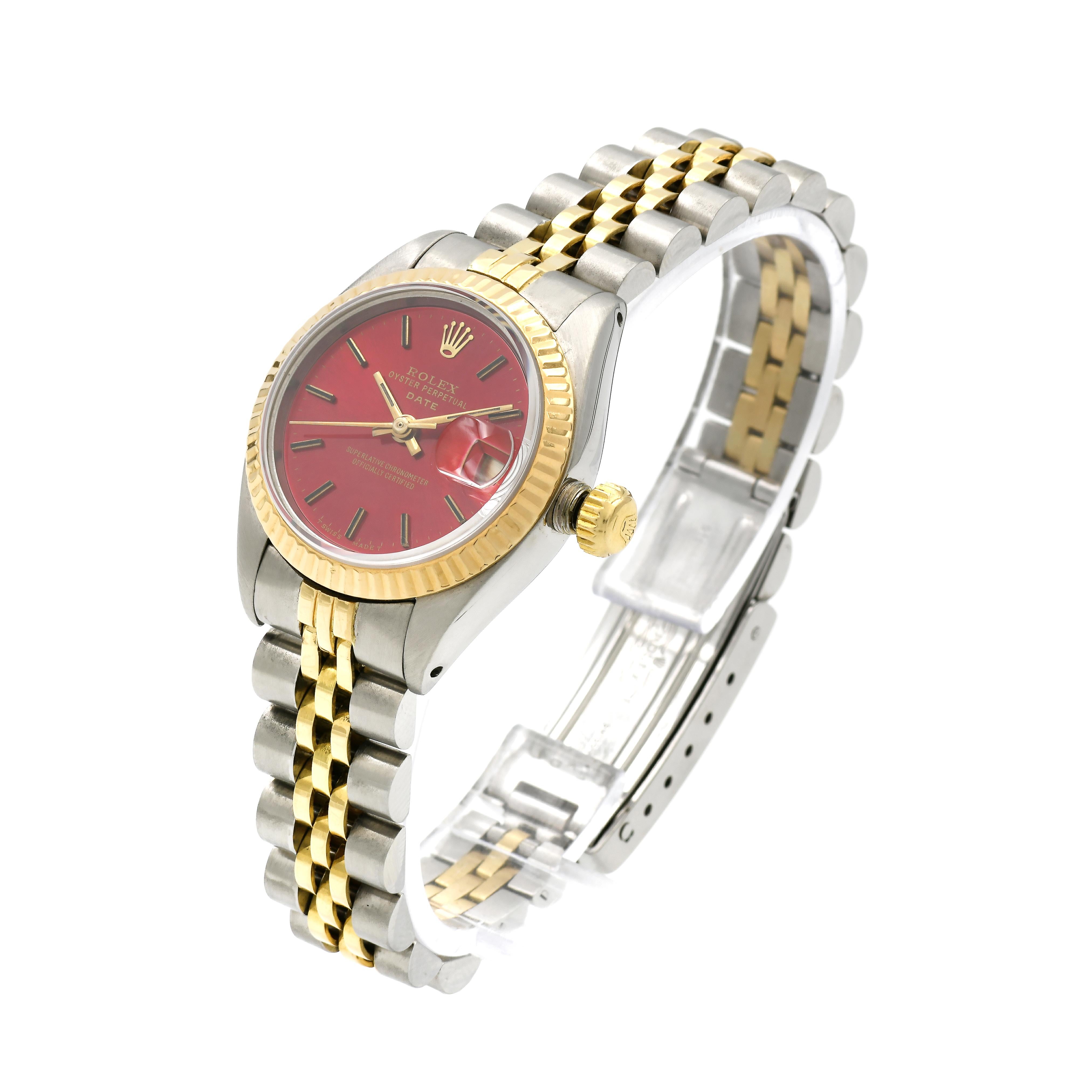  Ladies Rolex Datejust 6917 wristwatch. 18k gold and stainless steel with custom refinished bright shiny red Rolex dial. Jubilee band. Circa 1977.

18k yellow gold & stainless steel 
54.9 grams 
Length: 6 7/8 inches – can be shortened – links may be