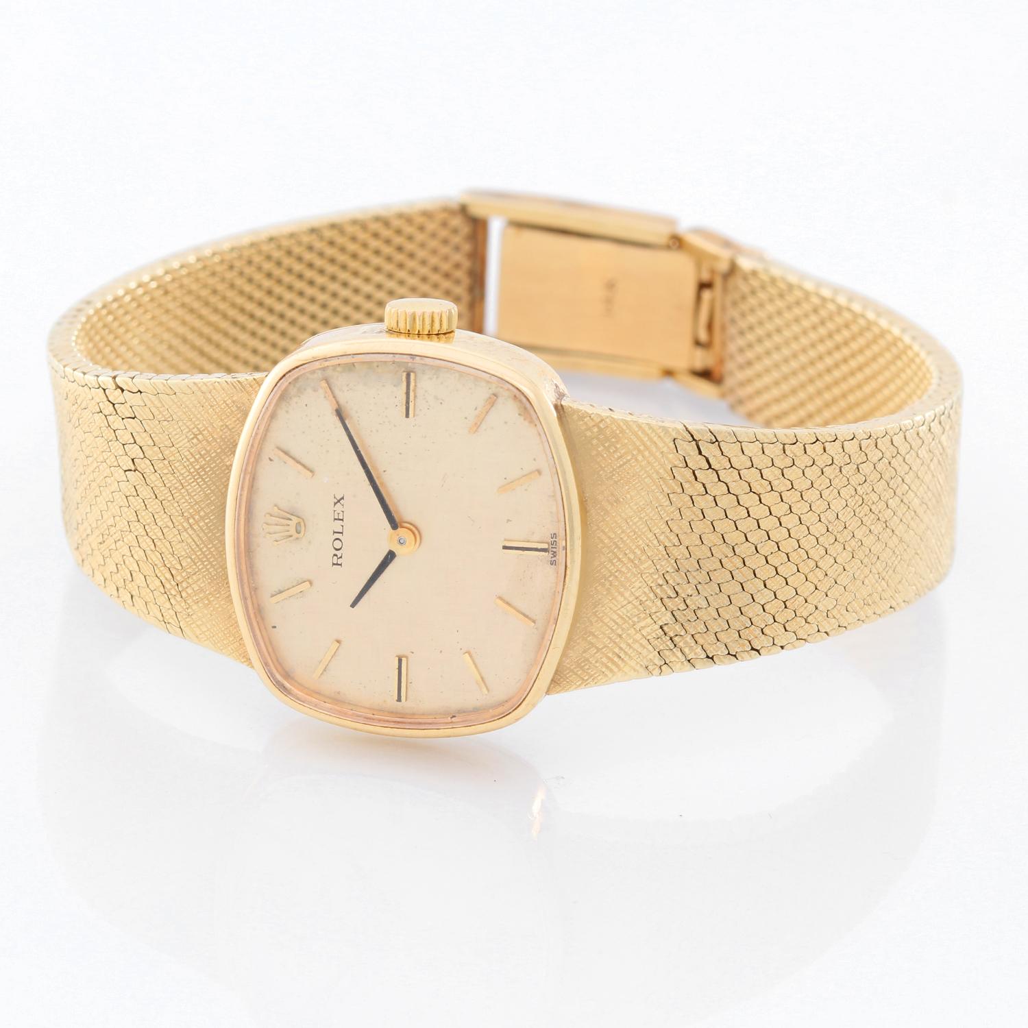 Vintage Rolex 14K Yellow Gold Rolex Watch Circa 1960's  - Quartz. 14K Yellow gold case ( 20 x 22 mm ) . Champagne textured dial with baton hour indexes. 14K yellow gold mesh bracelet . Pre-owned with custom box .