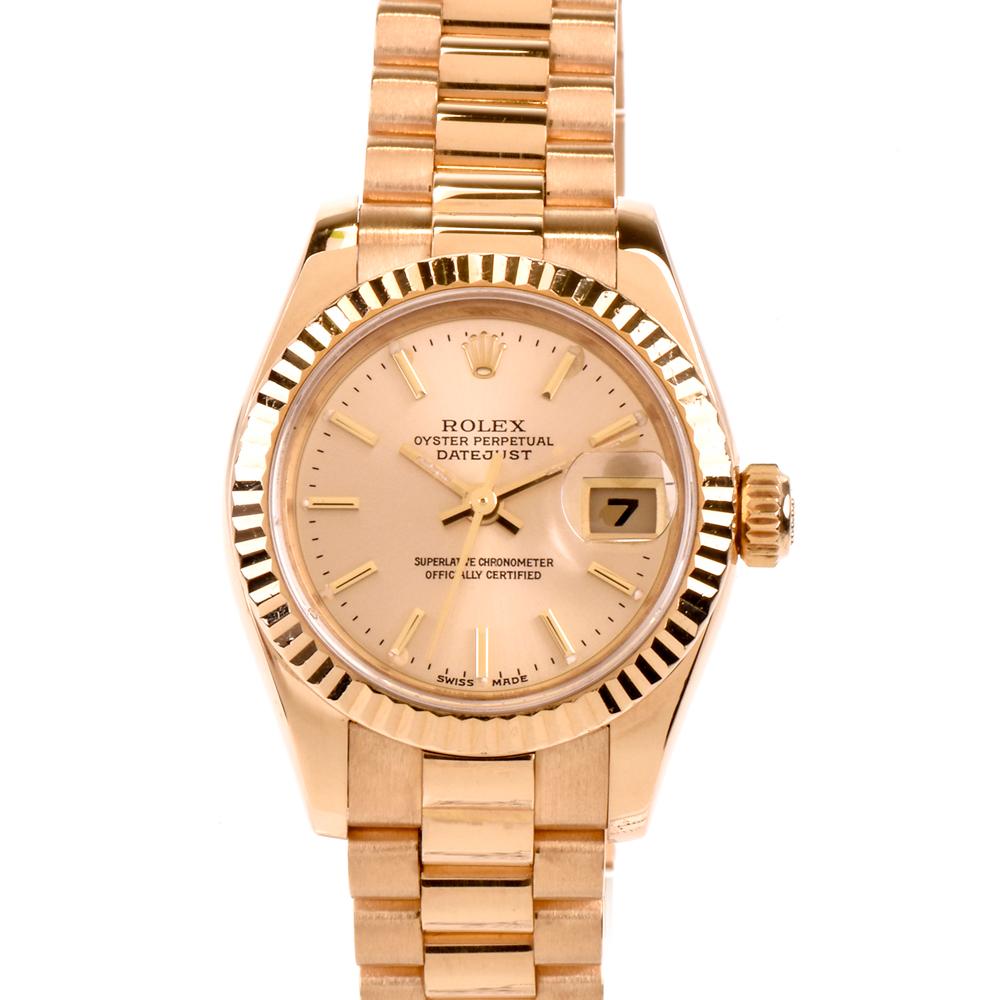 Rolex Ladies President Model 179178, Automatic winding. 18k yellow gold case with fluted bezel (26mm diameter). Sapphire crystal. yellow color gold  dial with gold/luminous-type stick markers. 18k yellow gold hidden-clasp Rolex President bracelet. Y