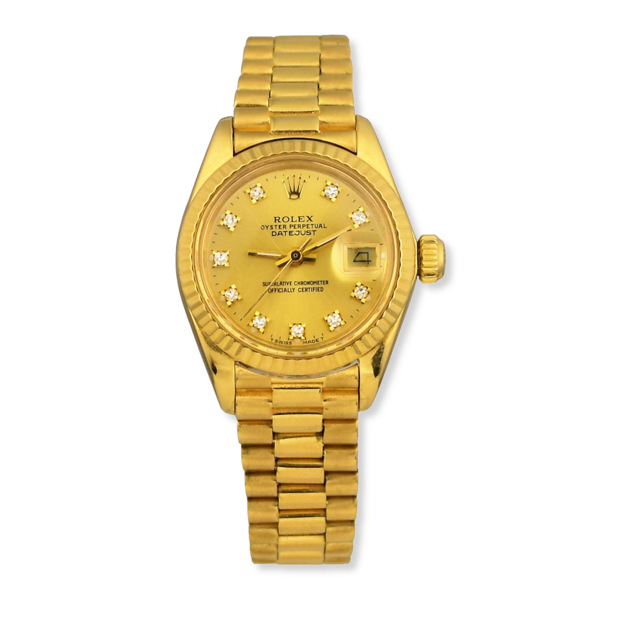 Brand: Rolex
Dial: Gold
Band Material: 18k Yellow Gold
Case Material: 18k Yellow Gold
Case size: 28mm
Hour Markers: Diamond Dial Hour Marker
Bezel: Rolex Fluted Bezel
 It has an original 18k yellow gold president band to give it the slickest look.