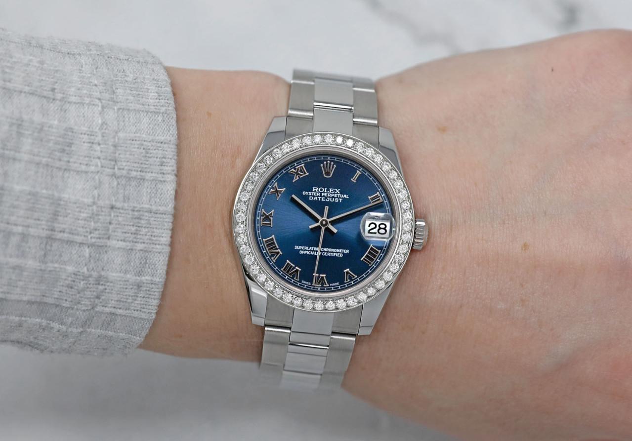 Rolex Lady-Datejust 31mm Blue Roman Dial with Diamond Bezel Stainless Steel Oyster 178240 

Genuine Rolex Datejust 31mm Stainless Steel with factory dial and custom diamond bezel. It has been polished, serviced and there are absolutely NO visible