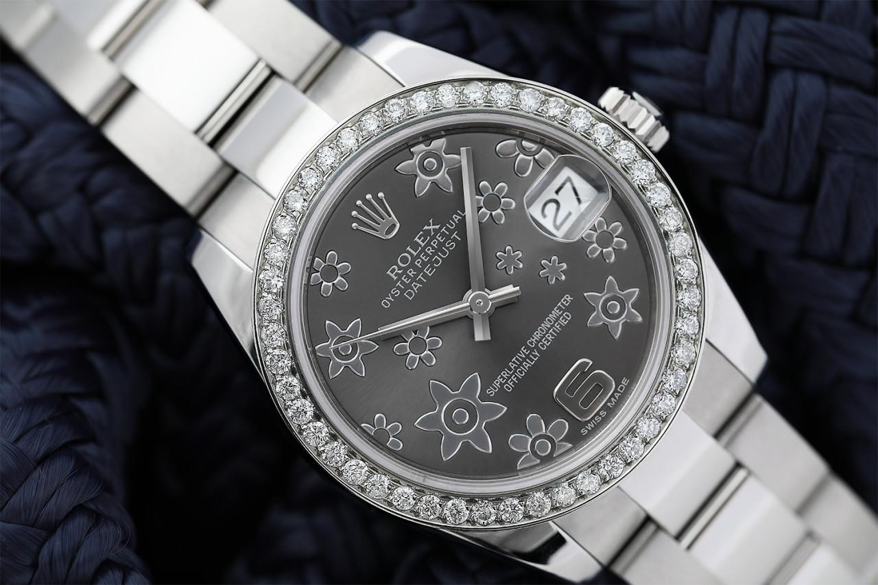 Rolex Lady-Datejust 31mm Stainless Steel Grey Flowe Dial with Diamond Bezel 178240

Genuine Rolex Datejust 31mm Stainless Steel with factory Grey Flower dial and custom diamond bezel. It comes with a Rolex box and appraisal certificate validating
