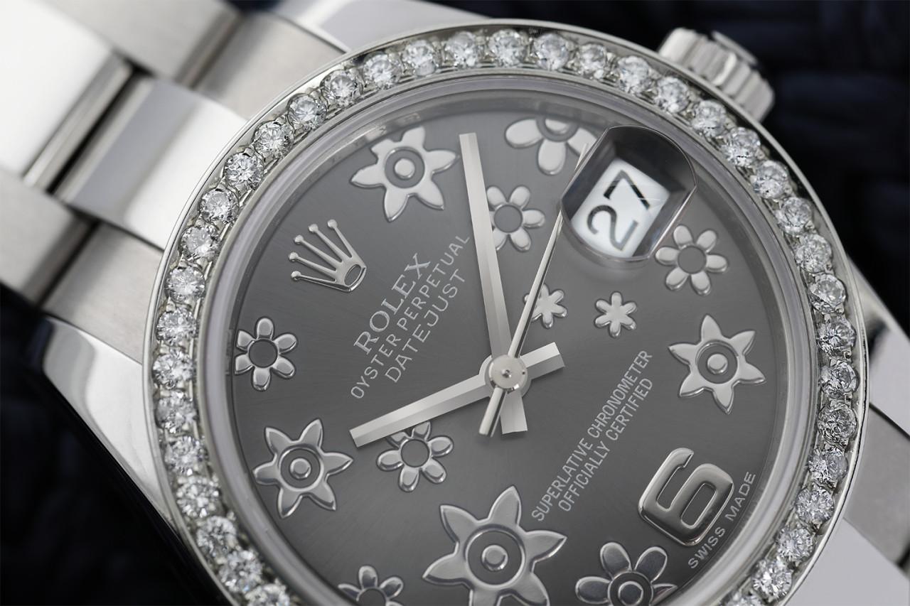 Rolex Lady-Datejust 31mm Stainless Steel Grey Flowe Dial with Diamond Bezel 178240

Genuine Rolex Datejust 31mm Stainless Steel with factory Grey Flower dial and custom diamond bezel. It comes with a Rolex box, Rolex warranty papers and appraisal