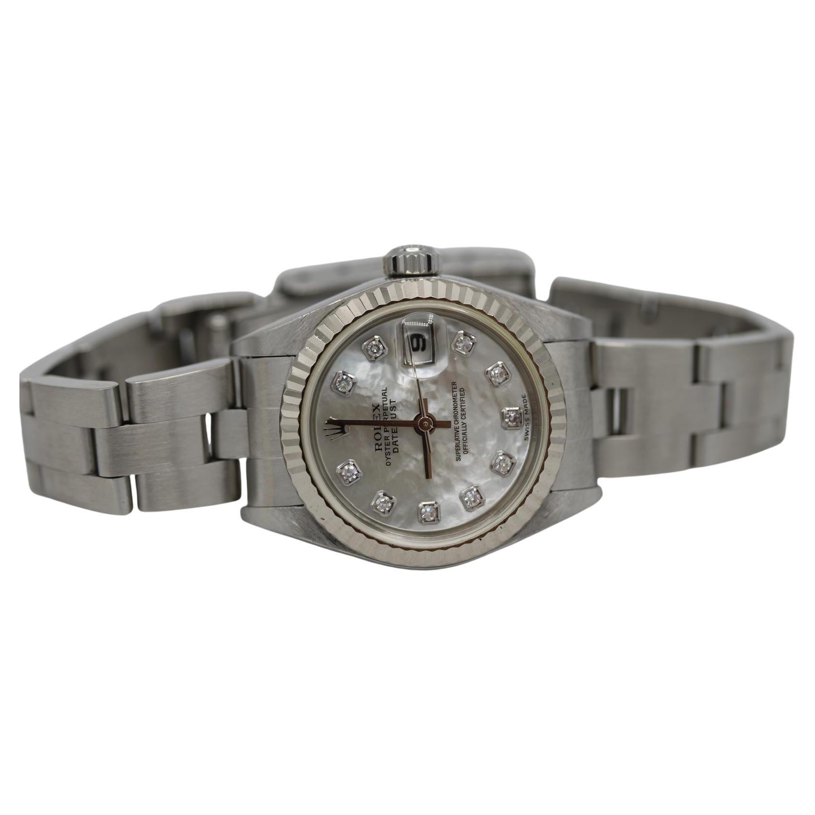 Rolex Lady Datejust 79174  Factory MOP Diamond Dial  Full Set  26mm

A truly immaculate example of the timeless Rolex Lady Datejust 79174, this model features a factory-set Mother of Pearl diamond dial paired with a white gold fluted bezel and is