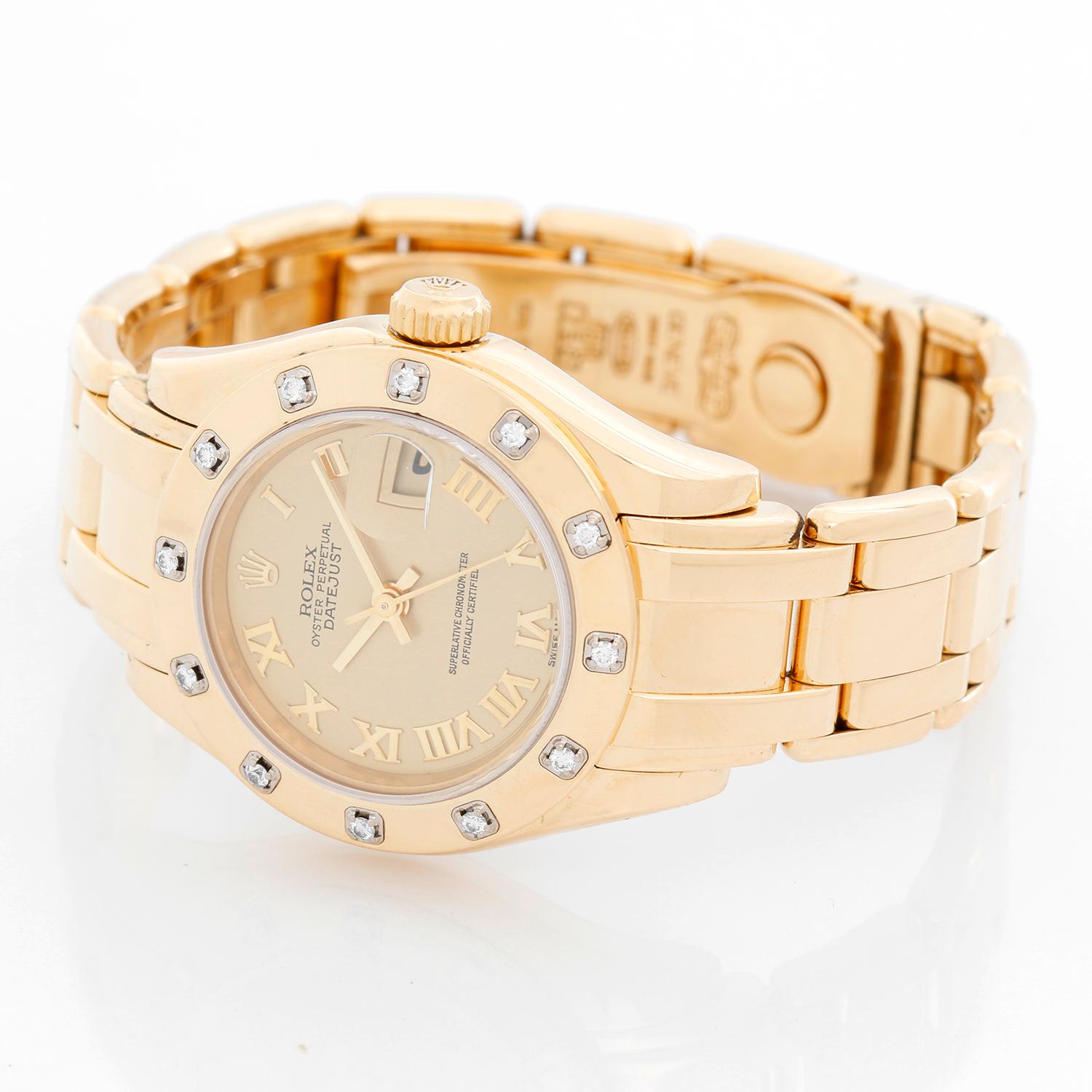 Rolex Lady Datejust Pearlmaster 18k Yellow Gold Ladies 69318 - Automatic winding, 31 jewels, Quickset, sapphire crystal. 18k yellow gold case with factory 12 diamond bezel (29mm diameter). Champagne dial with raised Roman numerals . 18k yellow gold