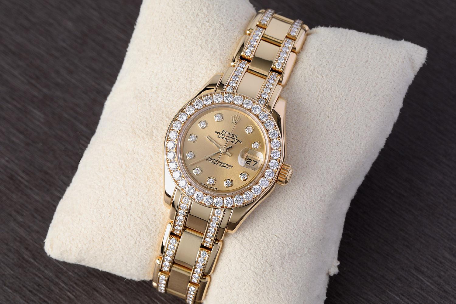 Watch is all factory. Gold-tone 18kt yellow gold case with a gold-tone 18kt yellow gold pearl master bracelet set with 162 diamonds. Fits up to a 6.5 inch wrist. Fixed diamond set bezel. Champagne dial with gold-tone hands and diamond index hour