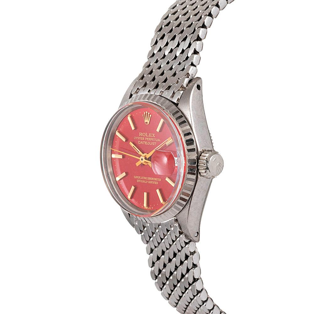 This classic lady Datejust is the most timeless and iconic of Rolex models, however this is a most uncommon example. The rarity is enhanced by the exclusive beauty of a Rolex red lacquer “Stella” dial. Original examples of these dials represent