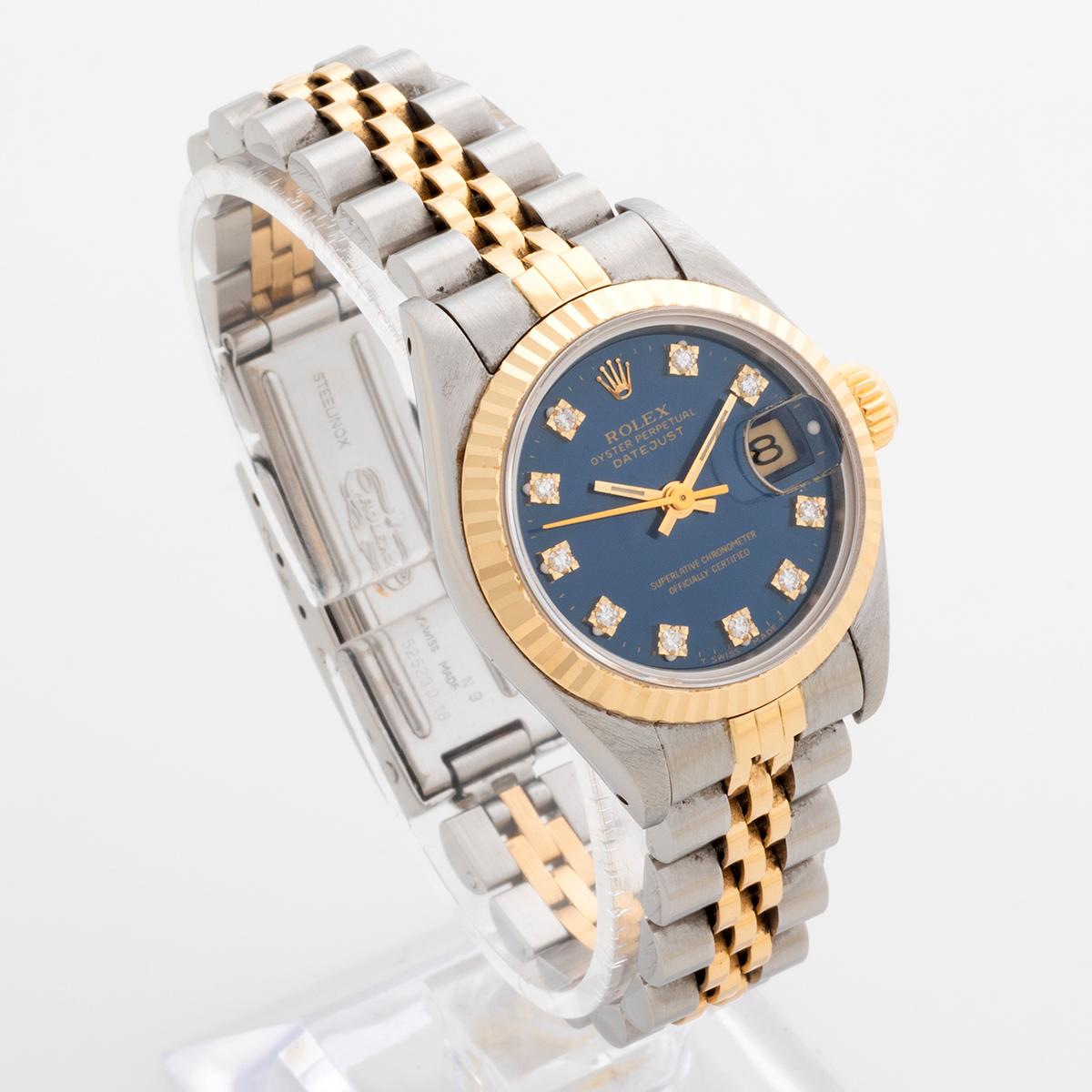 Our Rolex Lady Datejust , reference 69173 , features a factory diamond blue dial with stainless steel and 18k yellow gold case and bracelet. Presented in outstanding condition for its age, this has clearly been a cherished watch. Complete with