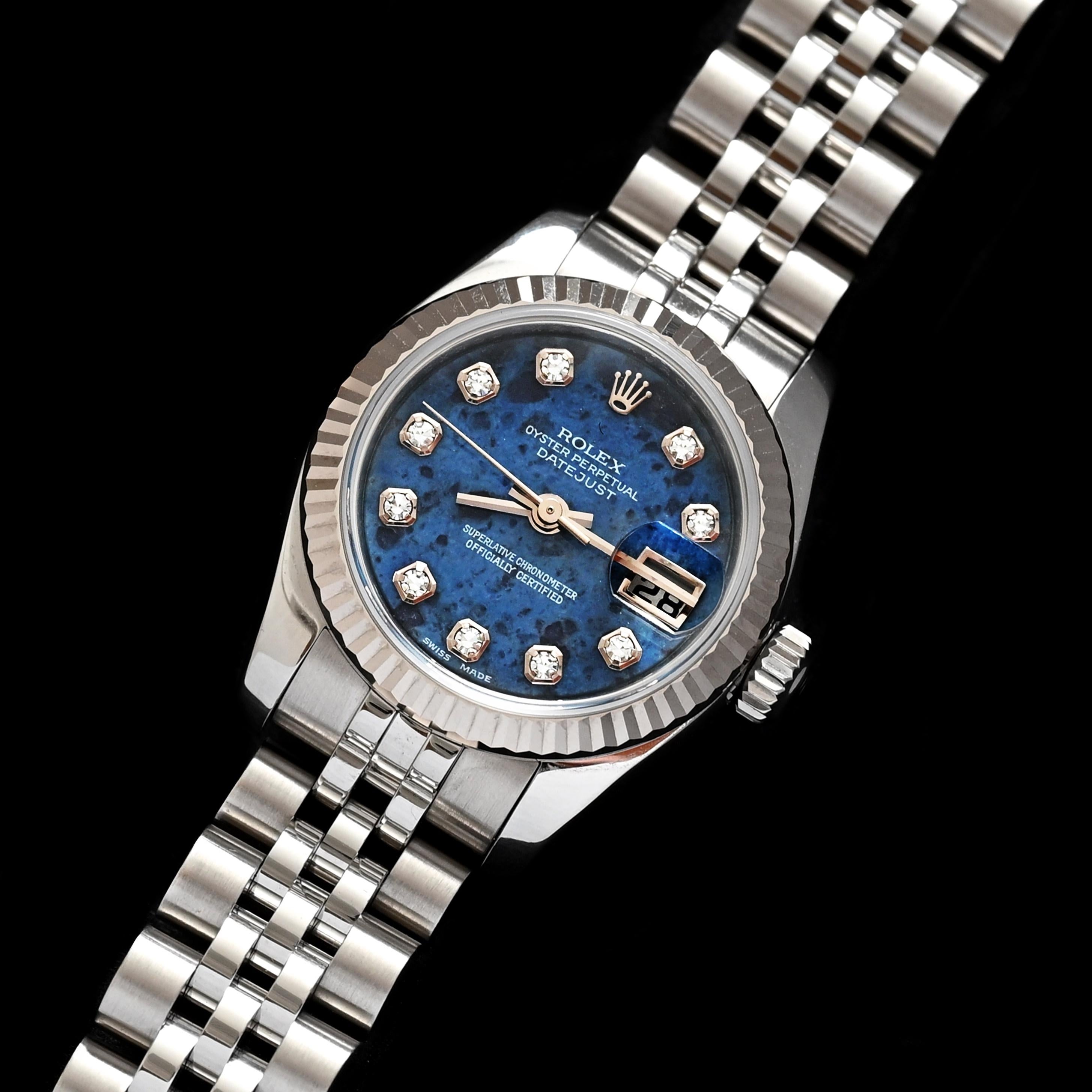 Brand: Rolex
Model: 179174
Year: 2014
Serial number: 85xxxxxx

Reference: C04427

Case: 26mm in diameter without crown; Show sign of wear with slight polish from previous w/ inner case back stamped 2320

Dial: Excellent Condition Natural Sodalite