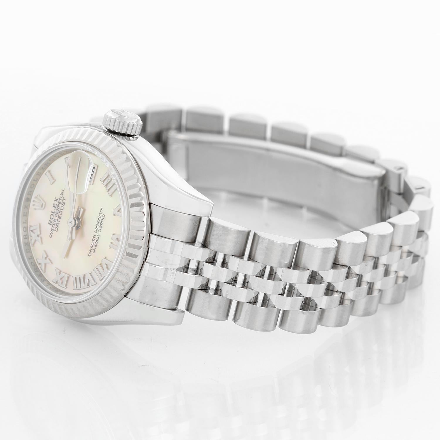 Rolex Lady Datejust Stainless Steel Ladies Watch 179174 - Automatic winding; 31 jewel; sapphire crystal. Stainless steel case with 18k white gold fluted bezel (26mm diameter). Factory Mother of Pearl . Stainless steel hidden-clasp Jubilee bracelet.
