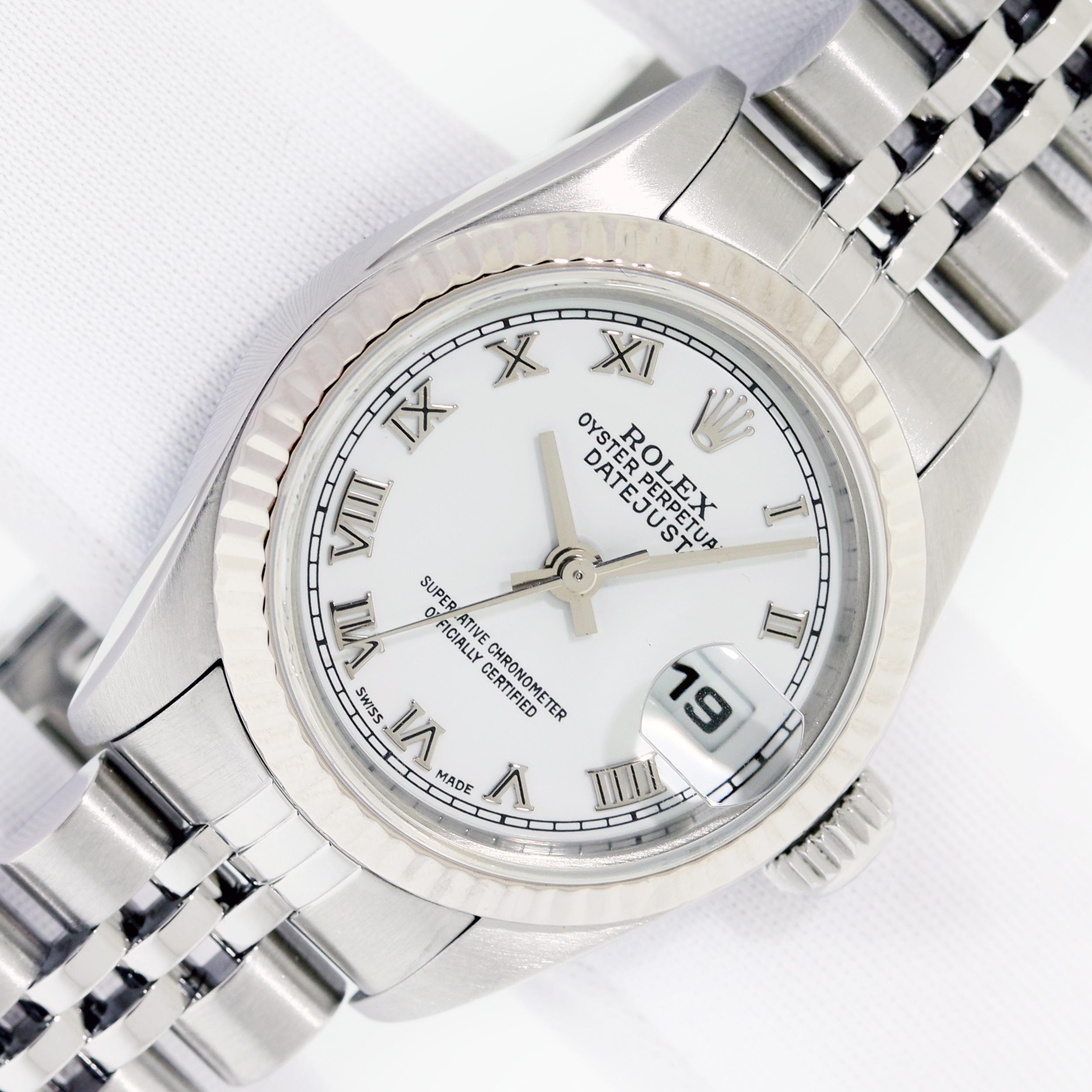 This Preowned Rolex Oyster Perpetual Datejust Has Recently Been Serviced, Polished and Will Be Time Tested Before Shipment. 

WATCH INFORMATION 

DIAL (FACE) 

Rolex White Dial set with Roman Hour Markers.
New Scratch Resistant Aftermarket Sapphire