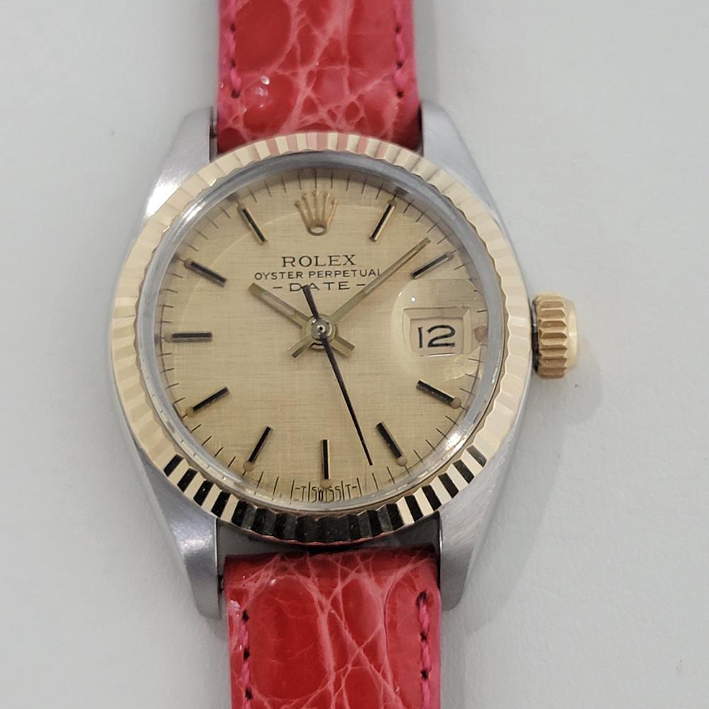 Timeless luxury, Rolex 18k gold and stainless steel Lady Oyster Perpetual Date automatic, c.1983, in excellent aesthetic and working condition. Verified authentic by a master watchmaker. Gorgeous Rolex linen dial with applied baton indice hour