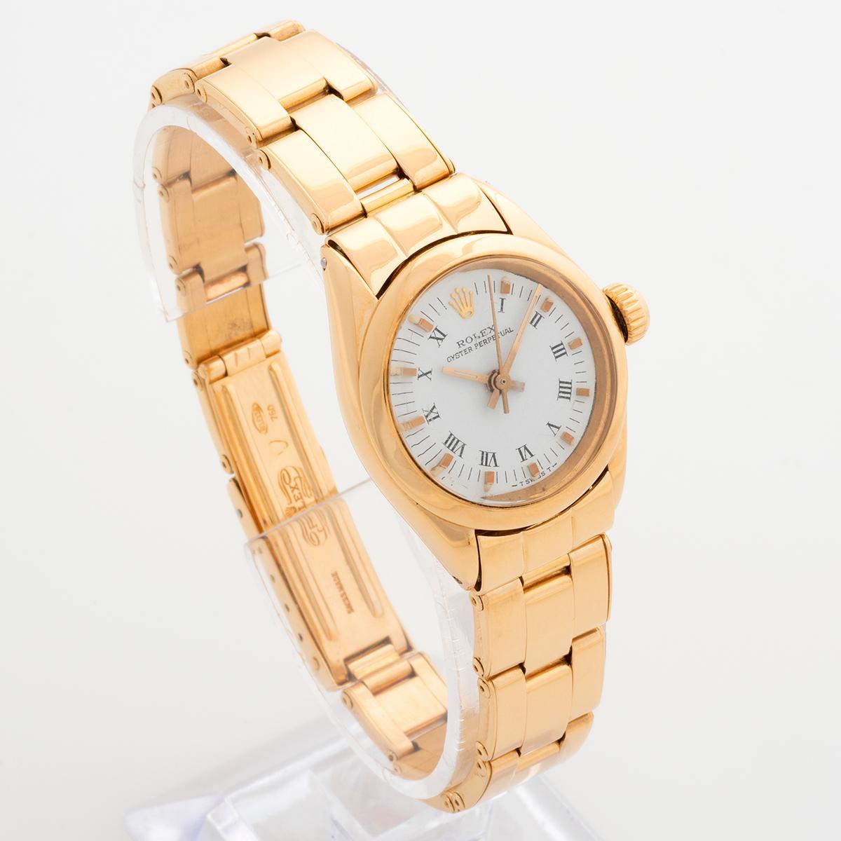 Our vintage and rare Rolex Lady Oyster Perpetual reference 6718 features an 18k yellow gold case and 18k riveted Oyster bracelet, with white Roman numeral dial. Presented in excellent condition, certainly given the age, our ladies Rolex Oyster has