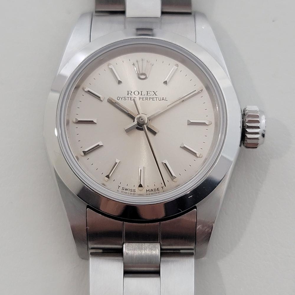 Charming luxury, Rolex all-stainless steel Lady Oyster Perpetual automatic, c.1988, all original, in excellent working condition, hardly ever worn. Verified authentic by a master watchmaker. Gorgeous Rolex silver dial with applied baton index hour