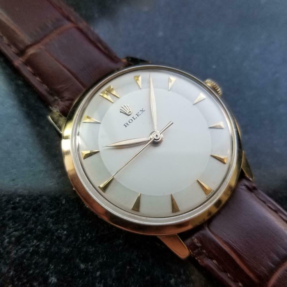 Luxury icon, men's 14k solid gold Rolex cal.1215 manual wind dress watch, c.1960s. Verified authentic by a master watchmaker. Gorgeous aged silver Rolex signed dial, applied dagger hour markers, gilt minute and hour hands, sweeping central second