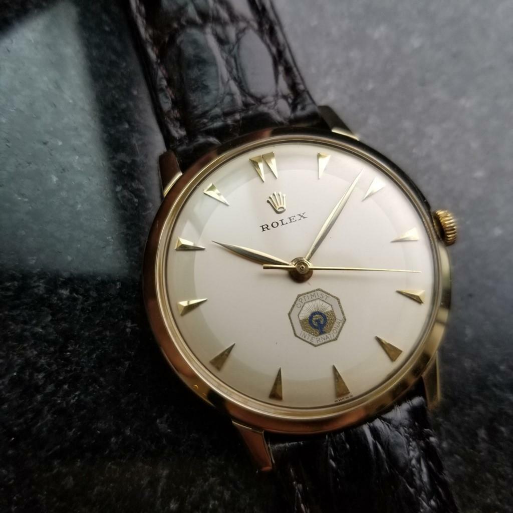 Men's vintage Rolex 14K yellow gold Optimist International c.1960. Verified authentic by a master watchmaker. Original Rolex cream dial with applied arrowhead hour markers, Rolex logo below the 12 marker, Optimist International logo above the 6 hour