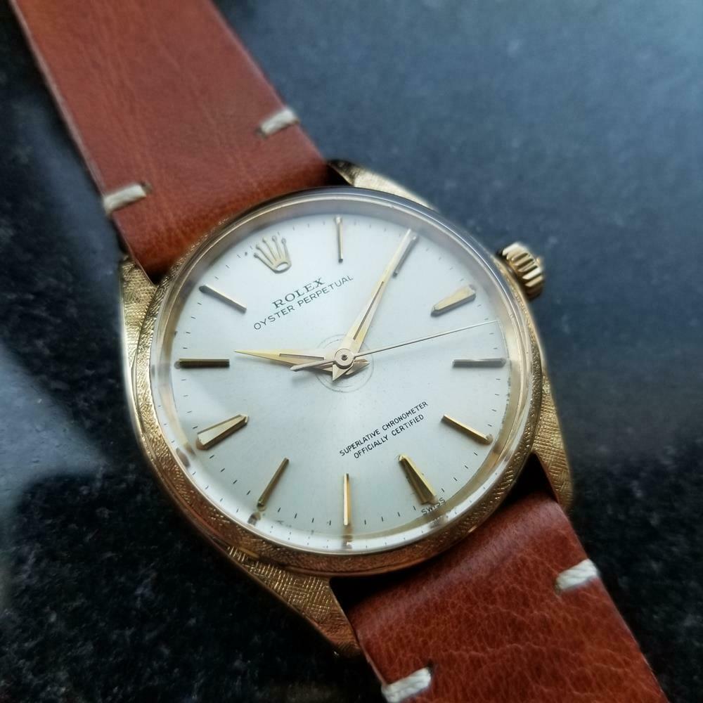 Rare timeless luxury, men's 18k solid gold Rolex Oyster Perpetual 1022 automatic with rare florentine finish, circa 1963. Verified authentic by a master watchmaker. Gorgeous vintage Rolex silver dial, applied gold indice hour markers, Rolex crown at