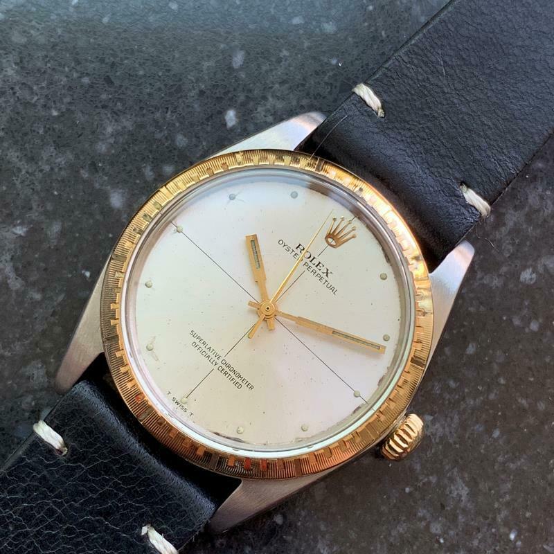Timeless icon, men's 18K gold & stainless steel Rolex Oyster Perpetual 1038 automatic, c.1969. Verified authentic by a master watchmaker. Original silver Rolex dial, beautifully tarnished due to age, applied droplet hour markers, Rolex crown at the