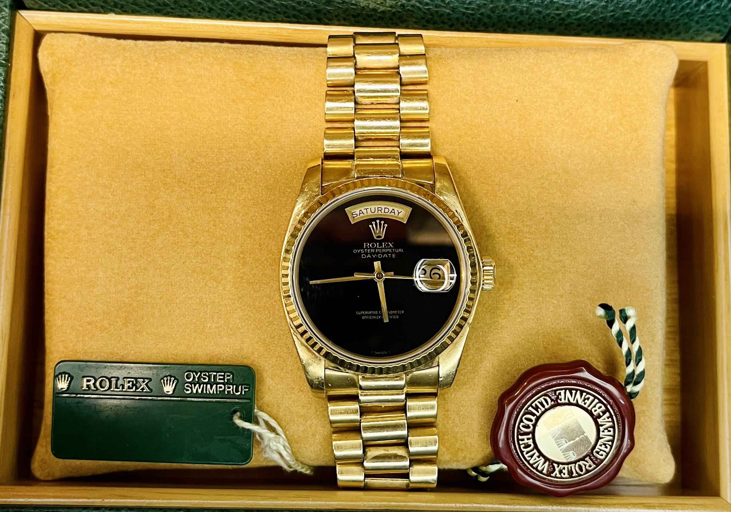 ROLEX MEN'S 18K YELLOW GOLD DAY-DATE PRESIDENT W/ BLACK ONYX DIAL – A TRUE COLLECTORS RARITY – FULL SET!

ITEM DESCRIPTION: 
One men's extraordinarily rare and collectible vintage day-date 18K yellow gold original Rolex president watch with the