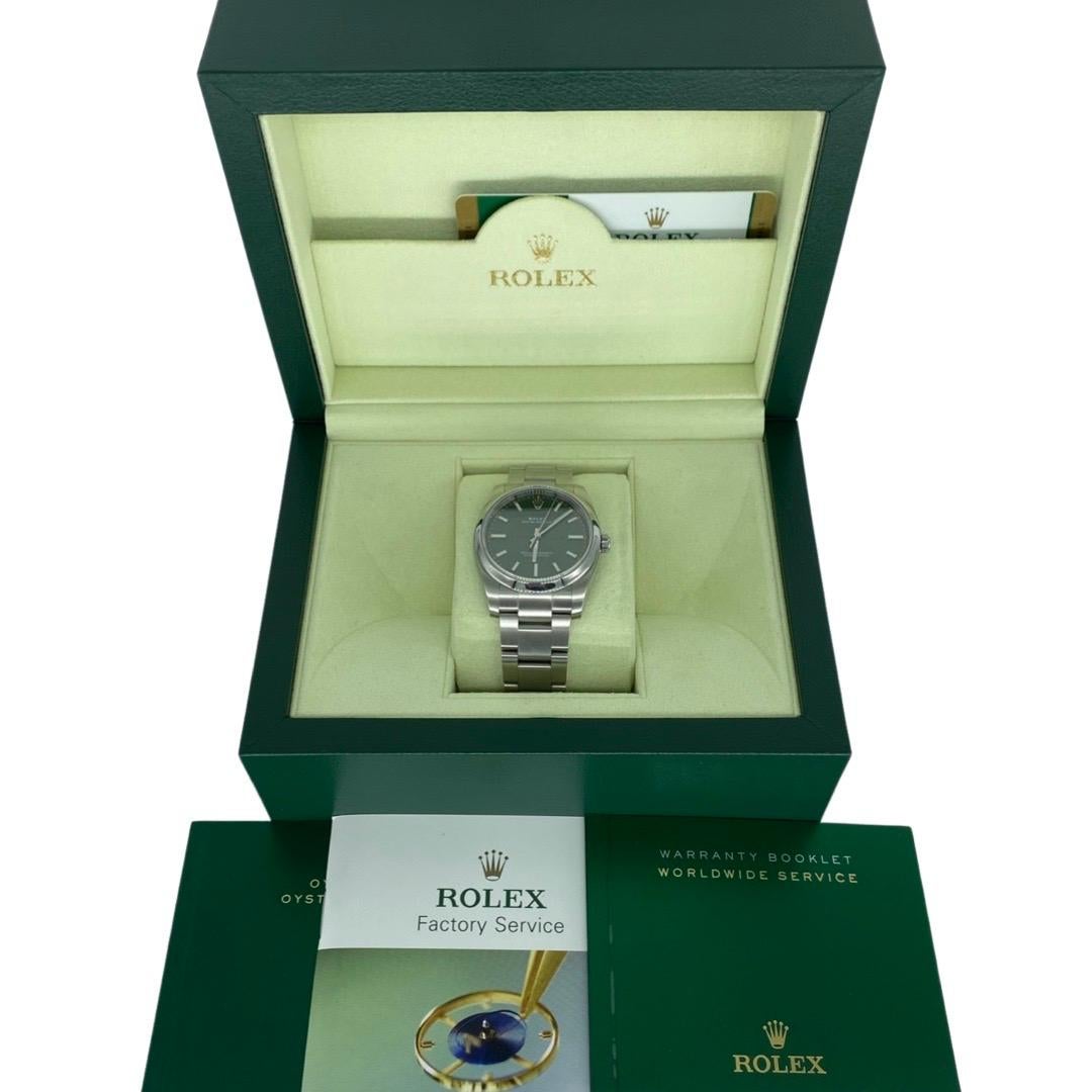 Rolex Perpetual Oyster Perpetual 34 Watch of Stainless Steel. Olive green dial with index hour markers. Screw-down solid crown with twin lock double waterproofness system. Scratch-resistant sapphire crystal. The watch has a central hour, minute and