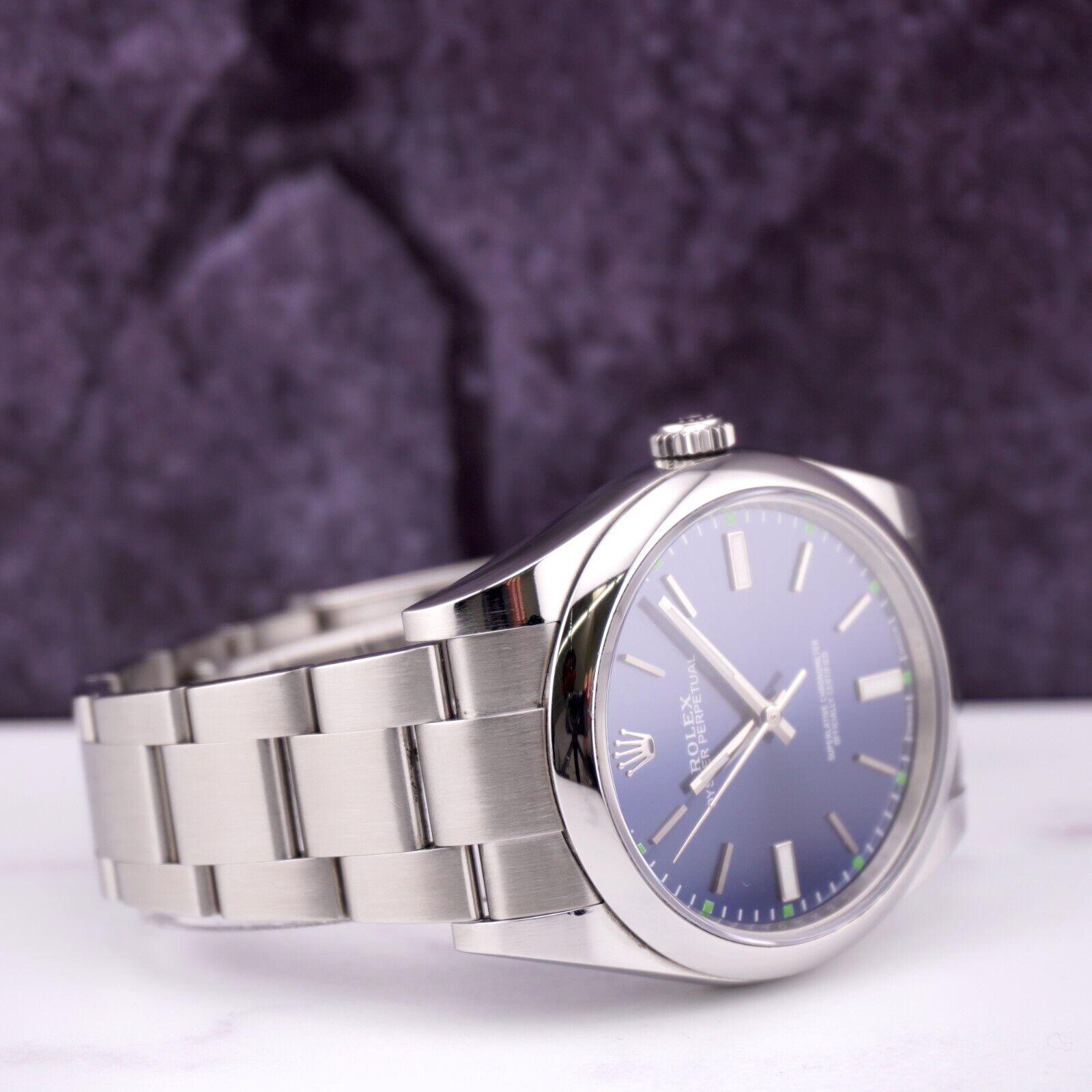 Modern Rolex Men's 39mm Oyster Perpetual Stainless Steel Blue Dial Watch Ref: 114300 For Sale