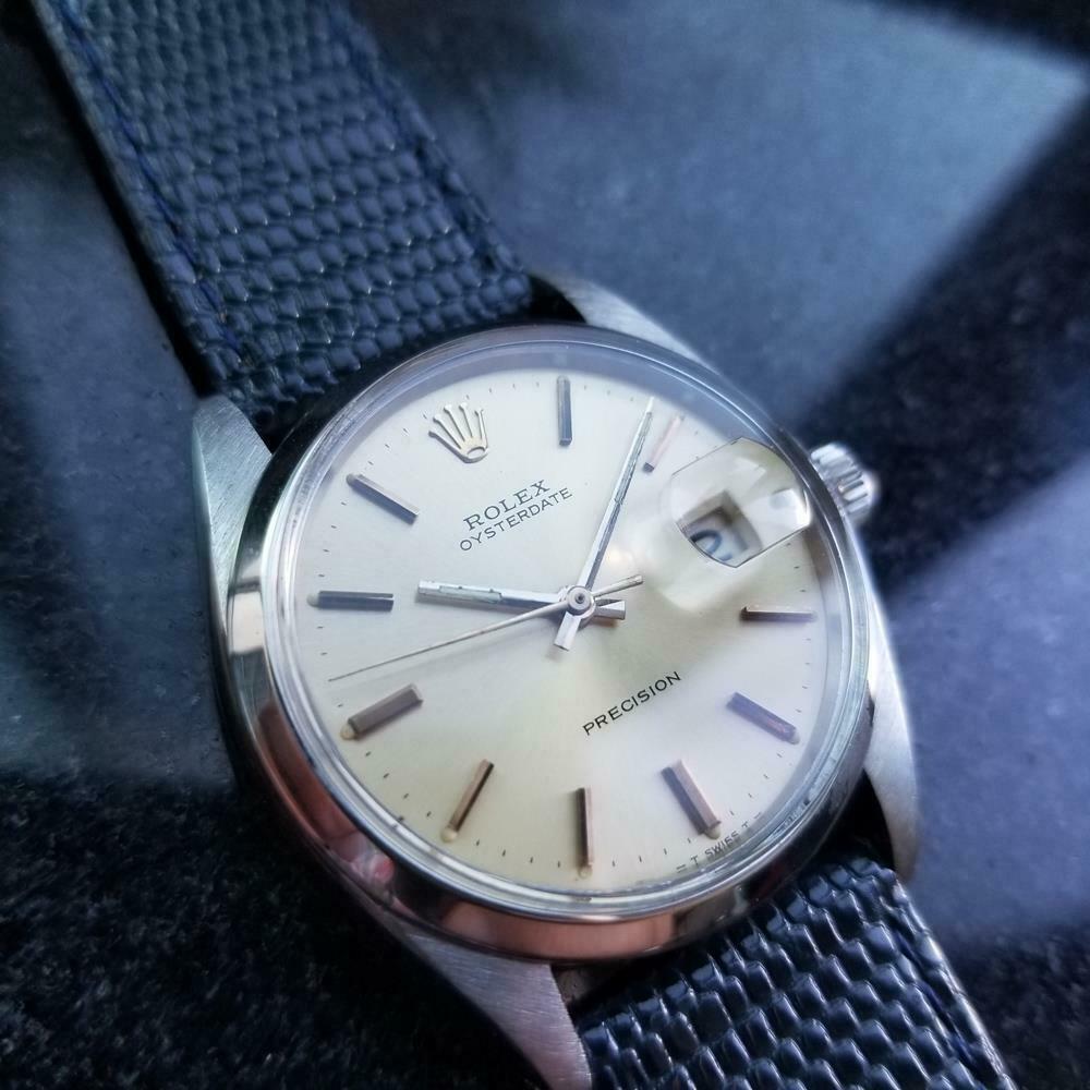 Vintage classic, men's midsize Rolex Oyster Perpetual 6548 automatic, c.1969. Verified authentic by a master watchmaker. Gorgeous silver vintage Rolex signed dial, applied index hour markers, silver minute and hour hands, sweeping central second
