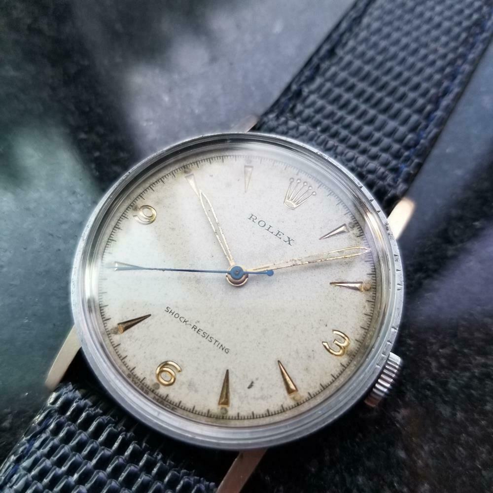 Timeless icon, rare men's Rolex ref.3742 manual hand-wind military dress watch, c.1938. Verified authentic by a master watchmaker. Original vintage Rolex signed cream dial, applied gold dagger and Arabic numeral 3, 6, 9 hour markers, gold minute and