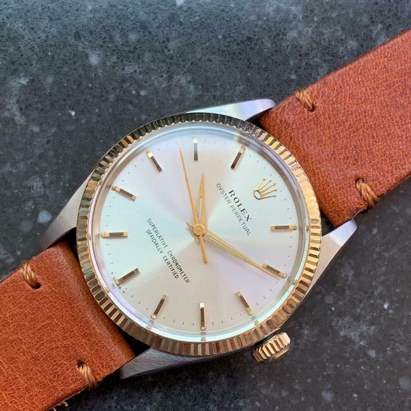 Timeless icon, men's 14K & ss Rolex Oyster Perpetual 1005 automatic, c.1966. Verified authentic by a master watchmaker. Gorgeous original, unrestored Rolex silver dial, applied gold baton hour markers, Rolex crown at the 12, gold minute and hour