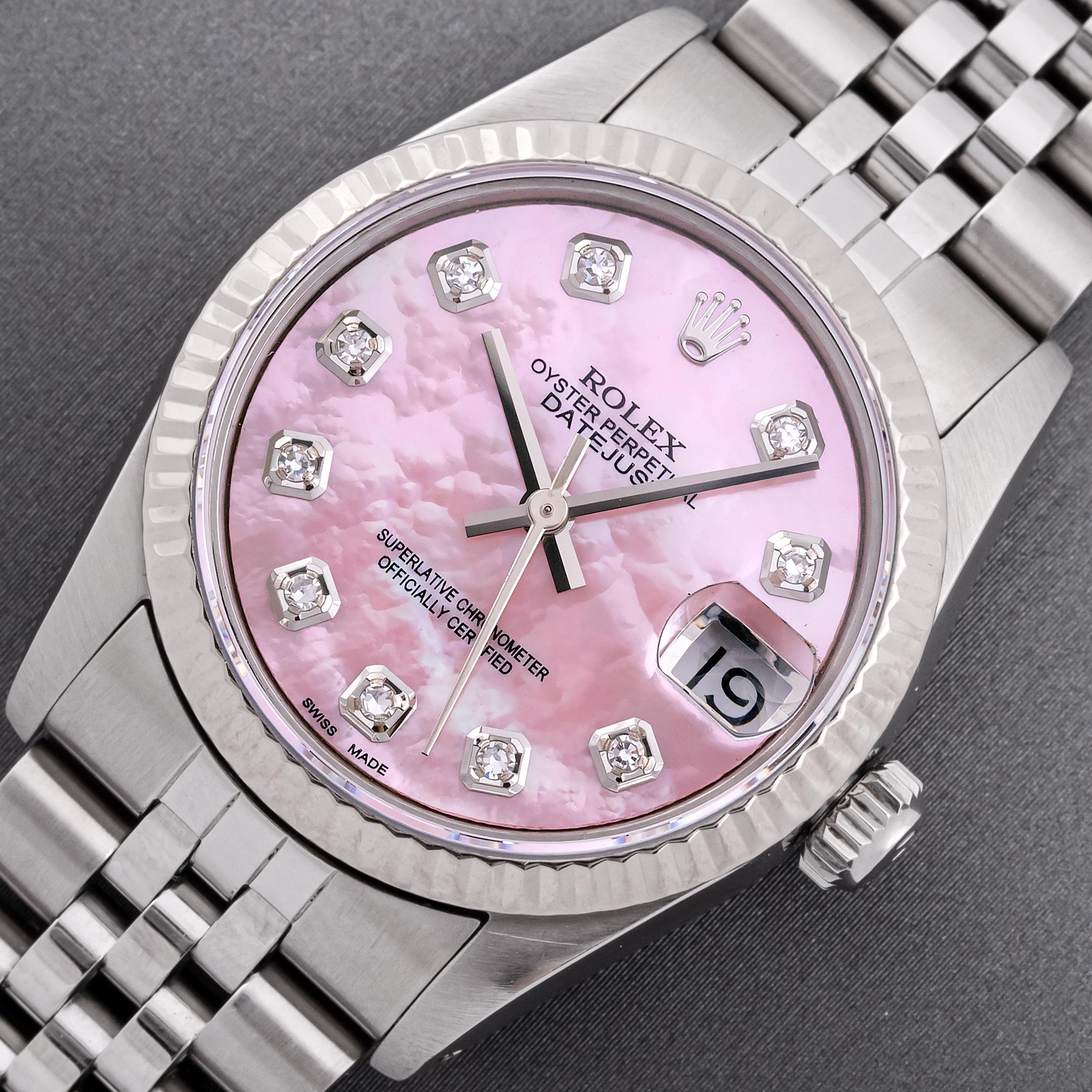 This Preowned Rolex Oyster Perpetual Datejust Has Recently Been Serviced, Polished and Will Be Time Tested Before Shipment. 

WATCH INFORMATION 

DIAL (FACE) 

Custom Pink  Mother of Pearl Dial set with Aftermarket 10 Added Genuine Round (VVS H