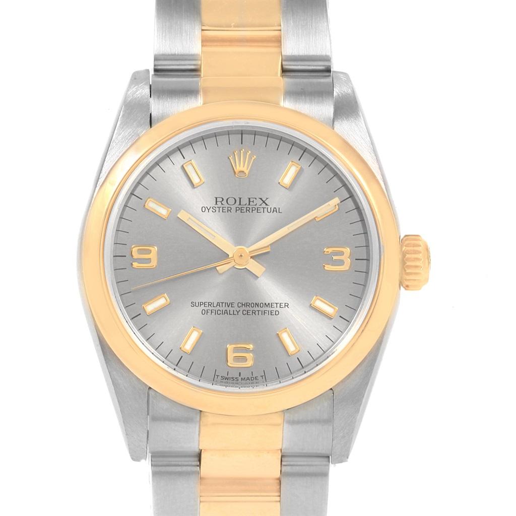 Rolex Midsize 31 Slate Dial Yellow Gold Steel Ladies Watch 77483. Officially certified chronometer self-winding movement. Stainless steel and 18K yellow gold round case 31 mm in diameter. Rolex logo on a crown. 18K yellow gold smooth domed bezel.