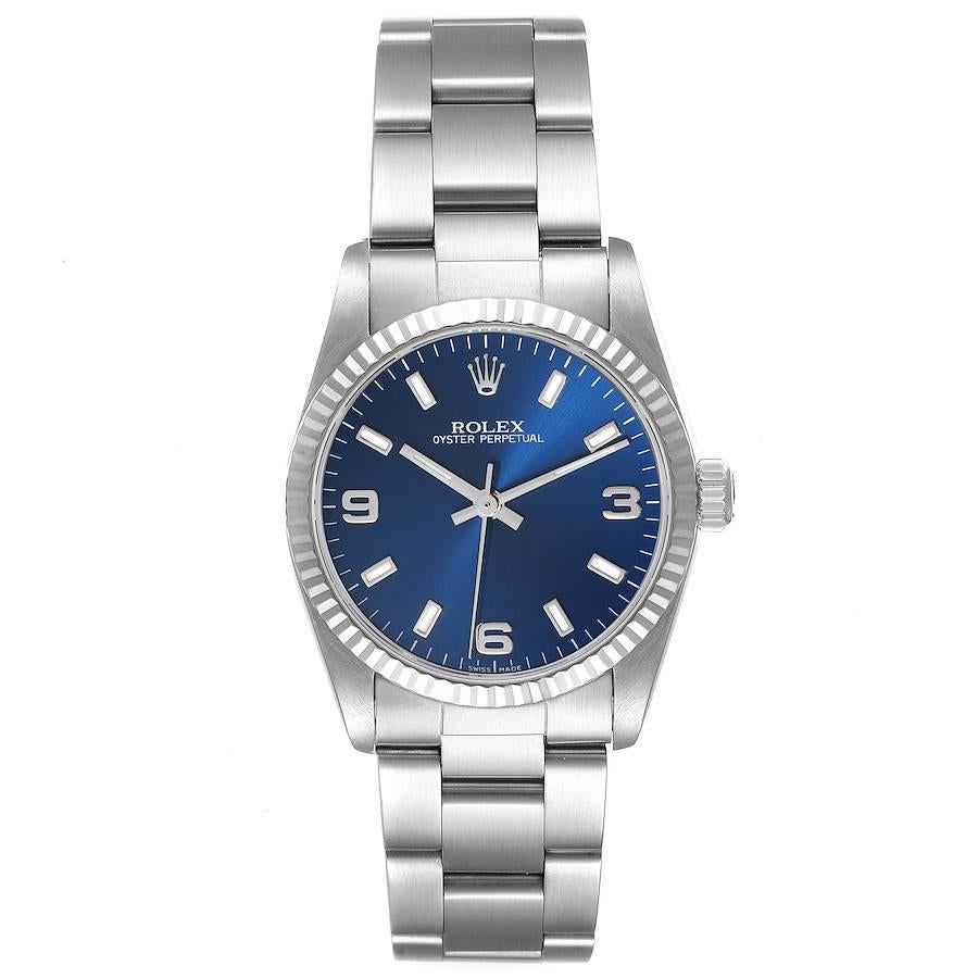 Rolex Midsize 31 Steel White Gold Blue Dial Ladies Watch 67514 Box Service Card. Officially certified chronometer self-winding movement. Stainless steel oyster case 31.0 mm in diameter. Rolex logo on a crown. 18K white gold fluted bezel. Scratch
