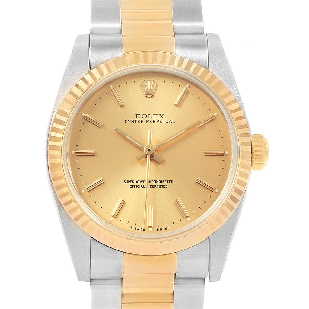 Rolex Midsize 31 Yellow Gold Steel Oyster Bracelet Ladies Watch 67513. Officially certified chronometer self-winding movement. Stainless steel and 18K yellow gold round case 31 mm in diameter. Rolex logo on a crown. 18K yellow gold fluted bezel.