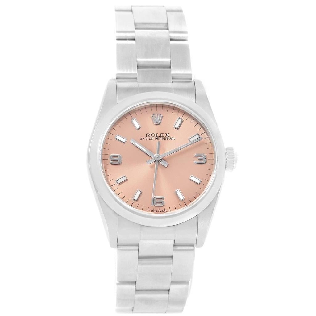 Rolex Midsize 31mm Salmon Dial Automatic Steel Ladies Watch 67480. Automatic self-winding movement. Stainless steel oyster case 31.0 mm in diameter. Rolex logo on a crown. Stainless steel smooth bezel. Scratch resistant sapphire crystal. Salmon dial