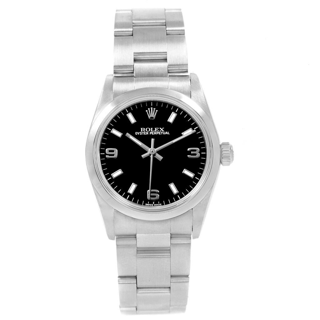 Rolex Midsize Black Dial Smooth Bezel Steel Ladies Watch 77080. Officially certified chronometer self-winding movement. Stainless steel oyster case 31.0 mm in diameter. Rolex logo on a crown. Stainless steel smooth bezel. Scratch resistant sapphire