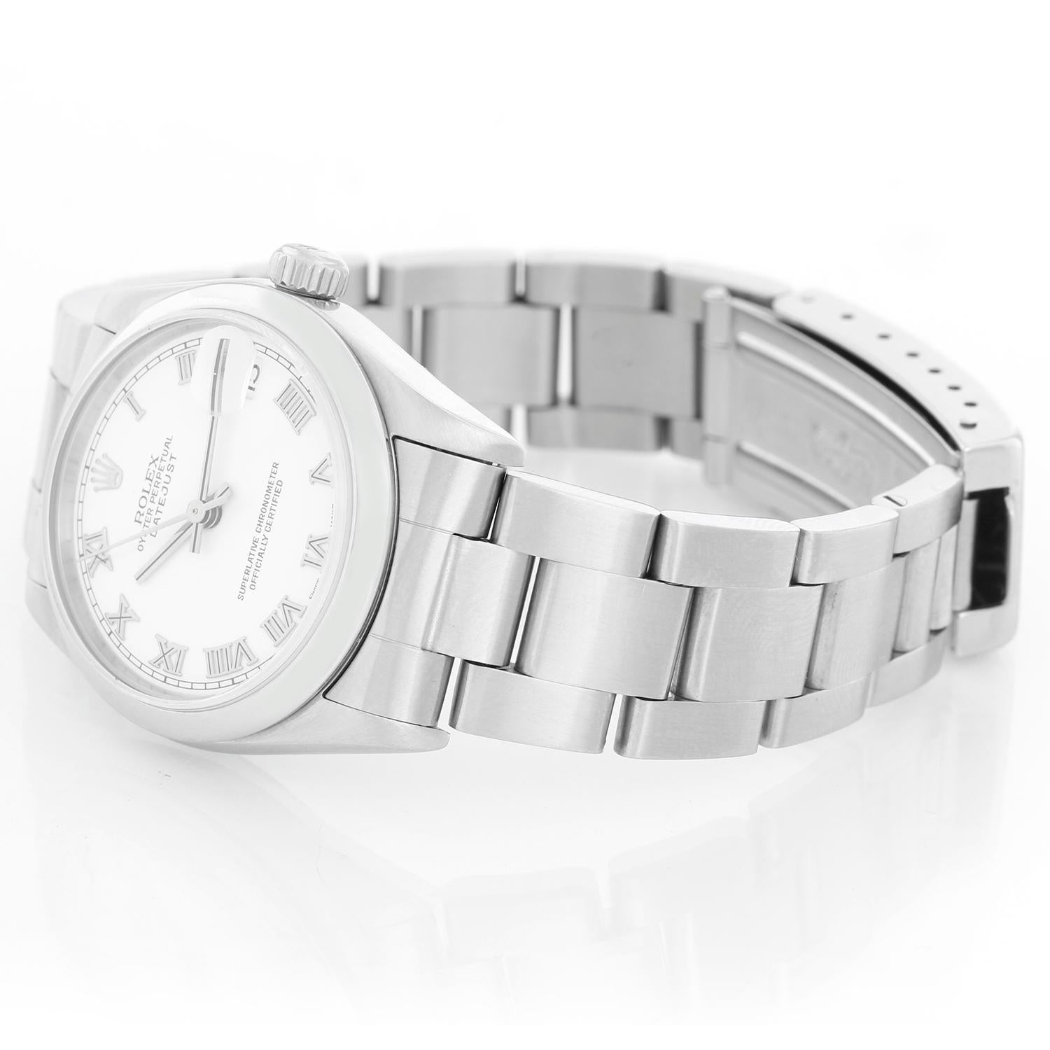 Rolex Midsize Date Stainless Steel Watch 78240 - Automatic winding, 31 jewels, Quickset, sapphire crystal. Stainless steel case with white gold smooth bezel 26mm diameter. White dial with Roman numerals . Stainless steel Oyster bracelet. Pre-owned