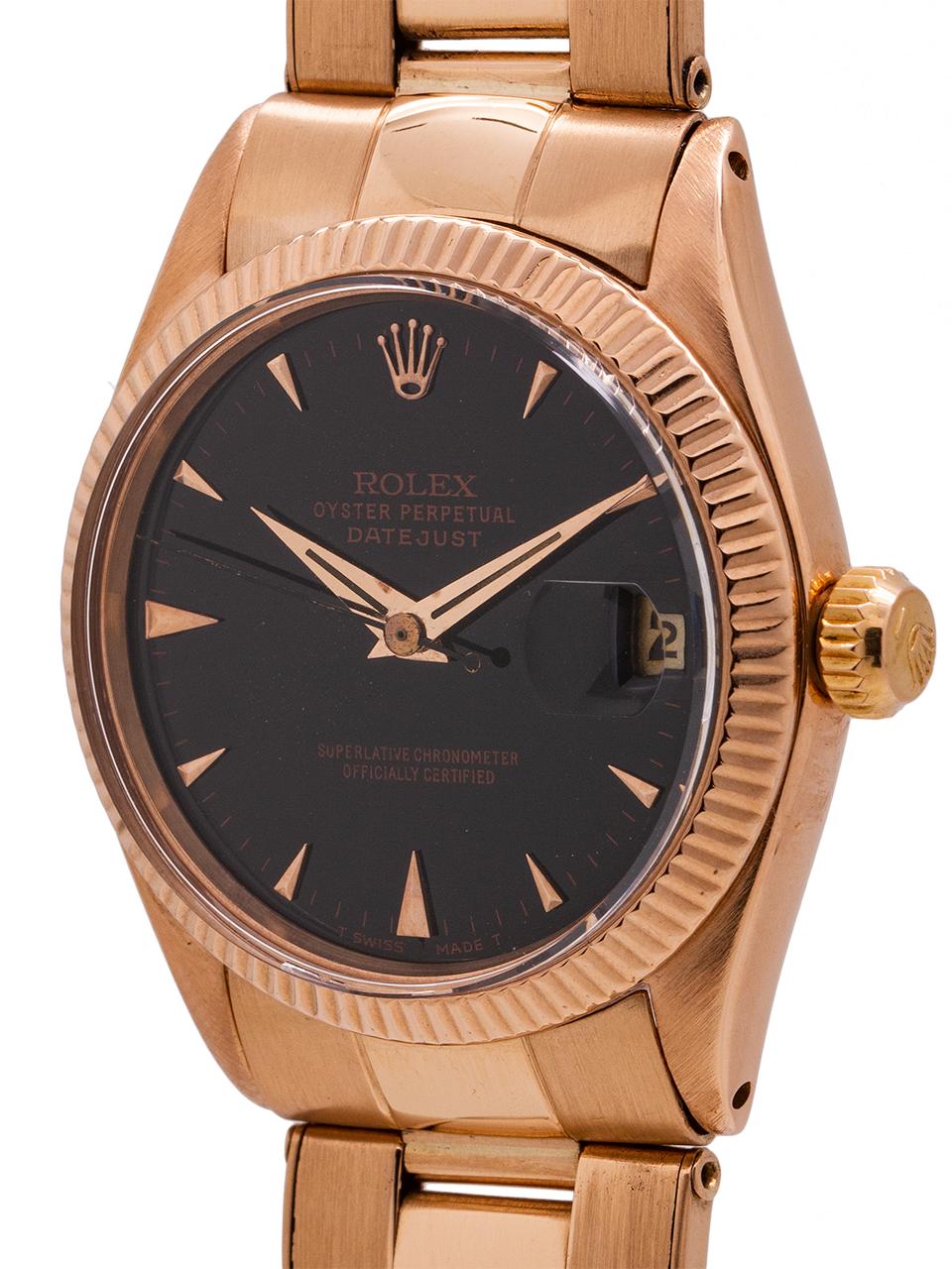 
Rolex midsize Datejust ref 6627 18K rose gold circa 1968. Featuring 31mm diameter case with fluted bezel, acrylic crystal, beautifully restored glossy black dial with applied pink indexes and pink baton hands and rose gold screw down crown. Powered