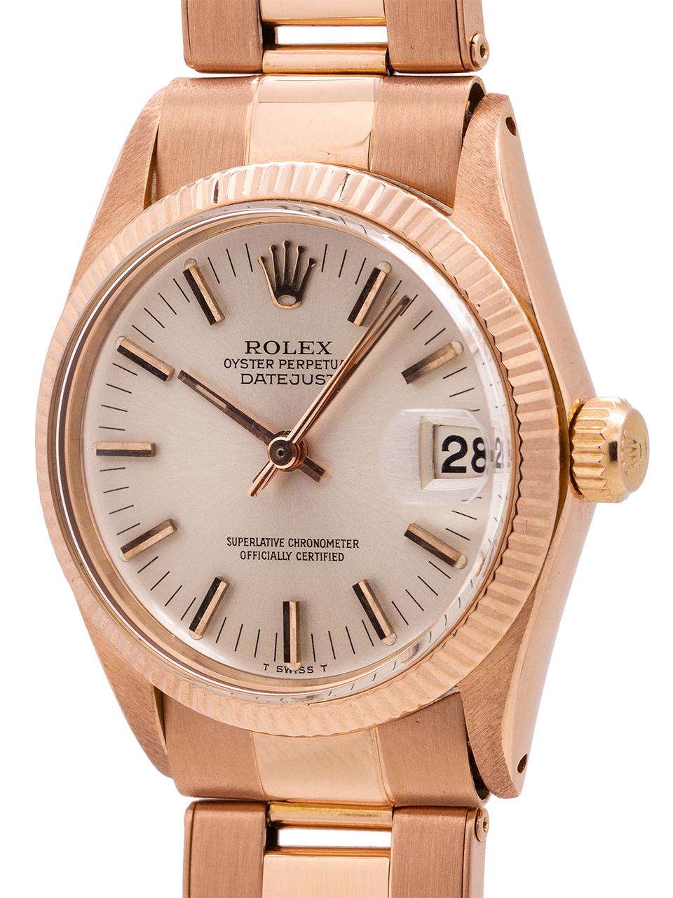 
 Rolex midsize Datejust 18K pink gold ref 6827 case serial # 6.7 million circa 1973. Featuring 31mm diameter case with fluted bezel, acrylic crystal and original silver satin dial with applied rose indexes and rose baton hands. Powered by self