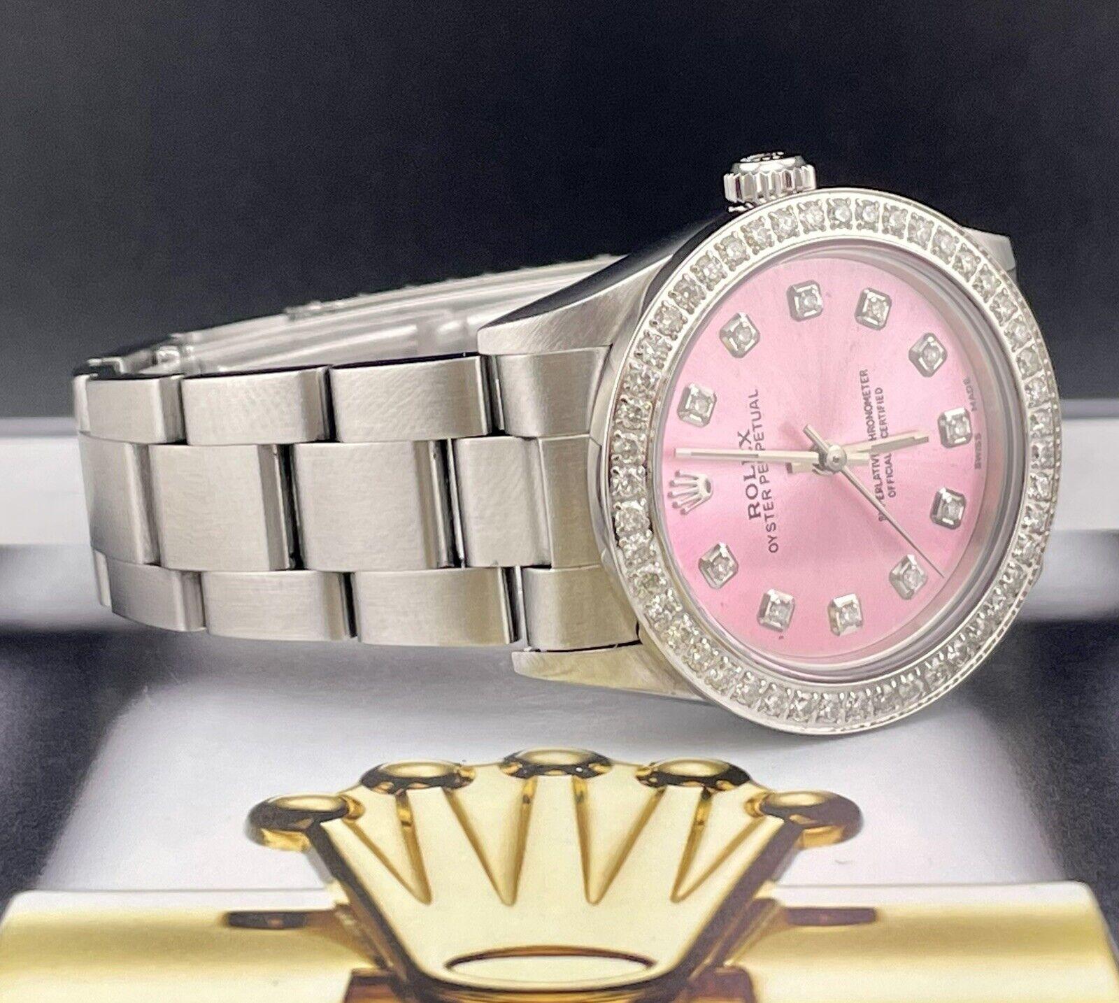 Rolex Oyster Perpetual 31mm Watch. A Pre-owned watch w/ Gift Box. Watch is 100% Authentic and Comes with Authenticity Card. Watch Reference is 67480 and is in Excellent Condition (See Pictures). The dial color is Pink (Have Other Colors!) and
