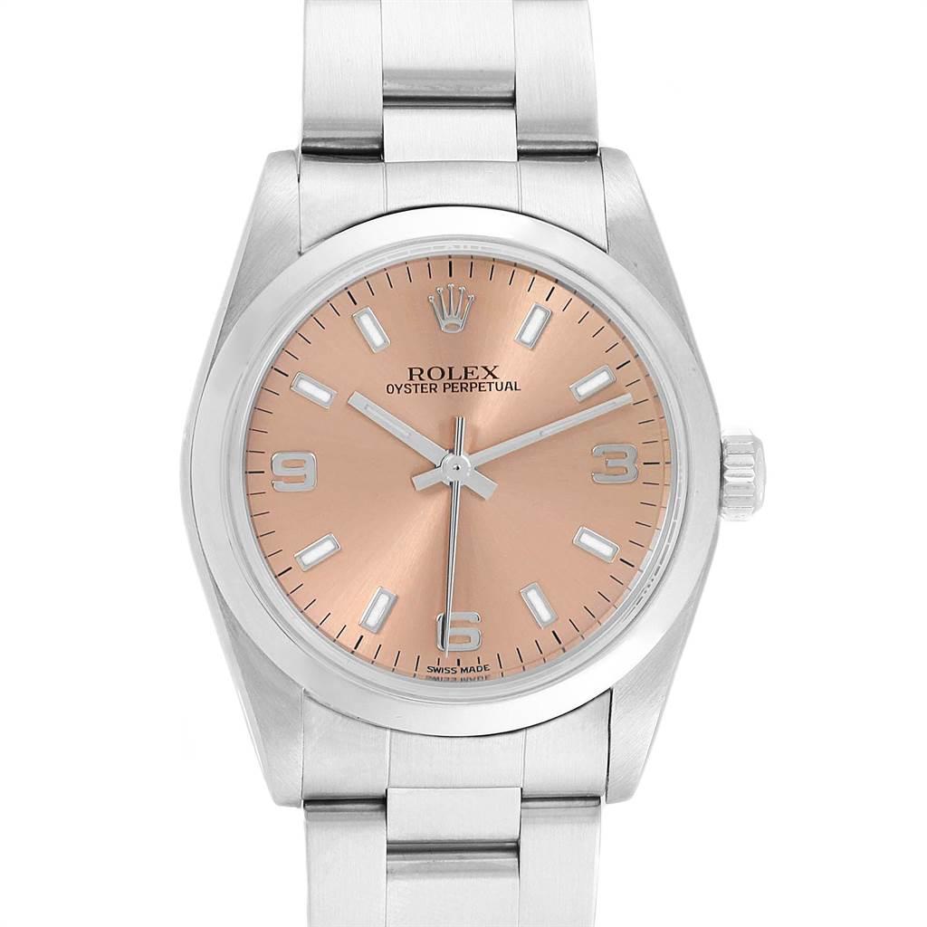 Rolex Midsize Salmon Dial Domed Bezel Steel Ladies Watch 77080. Officially certified chronometer self-winding movement. Stainless steel oyster case 31.0 mm in diameter. Rolex logo on a crown. Stainless steel smooth bezel. Scratch resistant sapphire