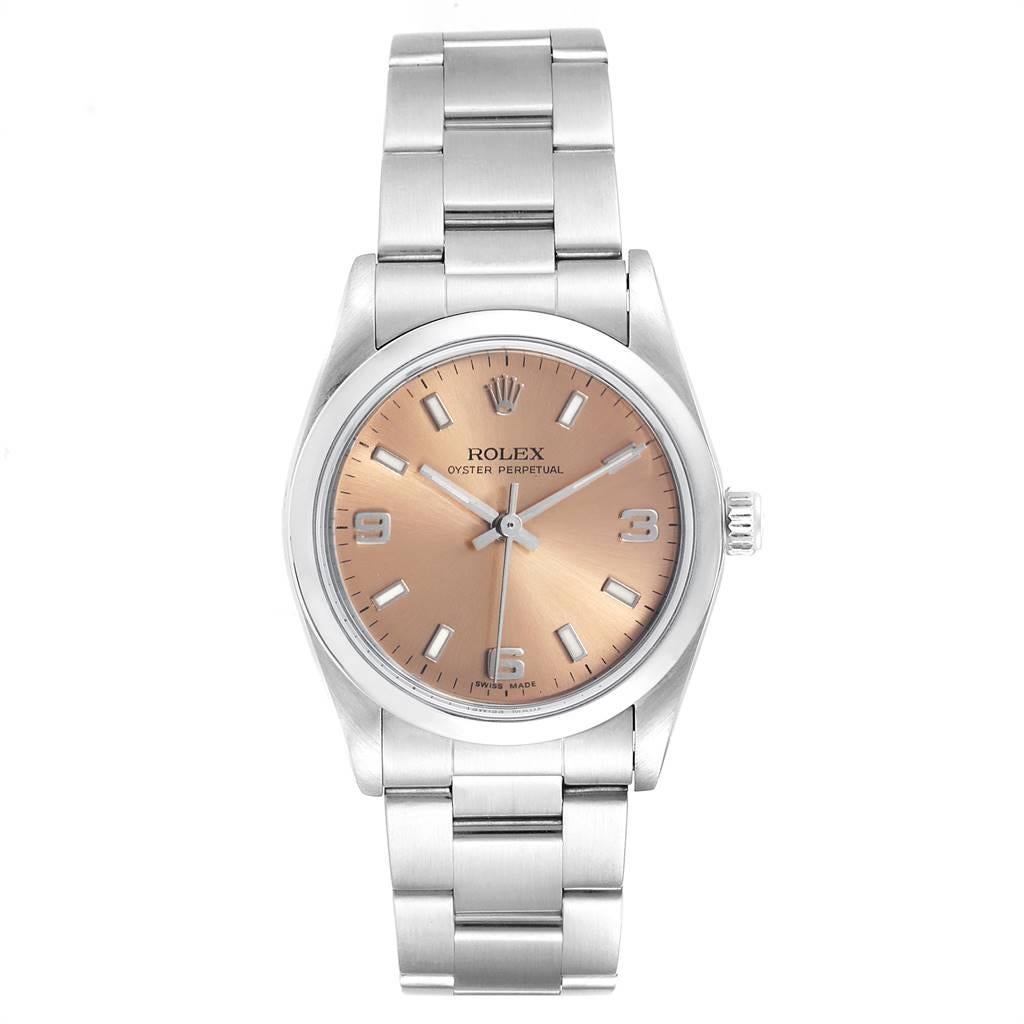 Rolex Midsize Salmon Dial Domed Bezel Steel Ladies Watch 77080. Officially certified chronometer self-winding movement. Stainless steel oyster case 31.0 mm in diameter. Rolex logo on a crown. Stainless steel smooth bezel. Scratch resistant sapphire