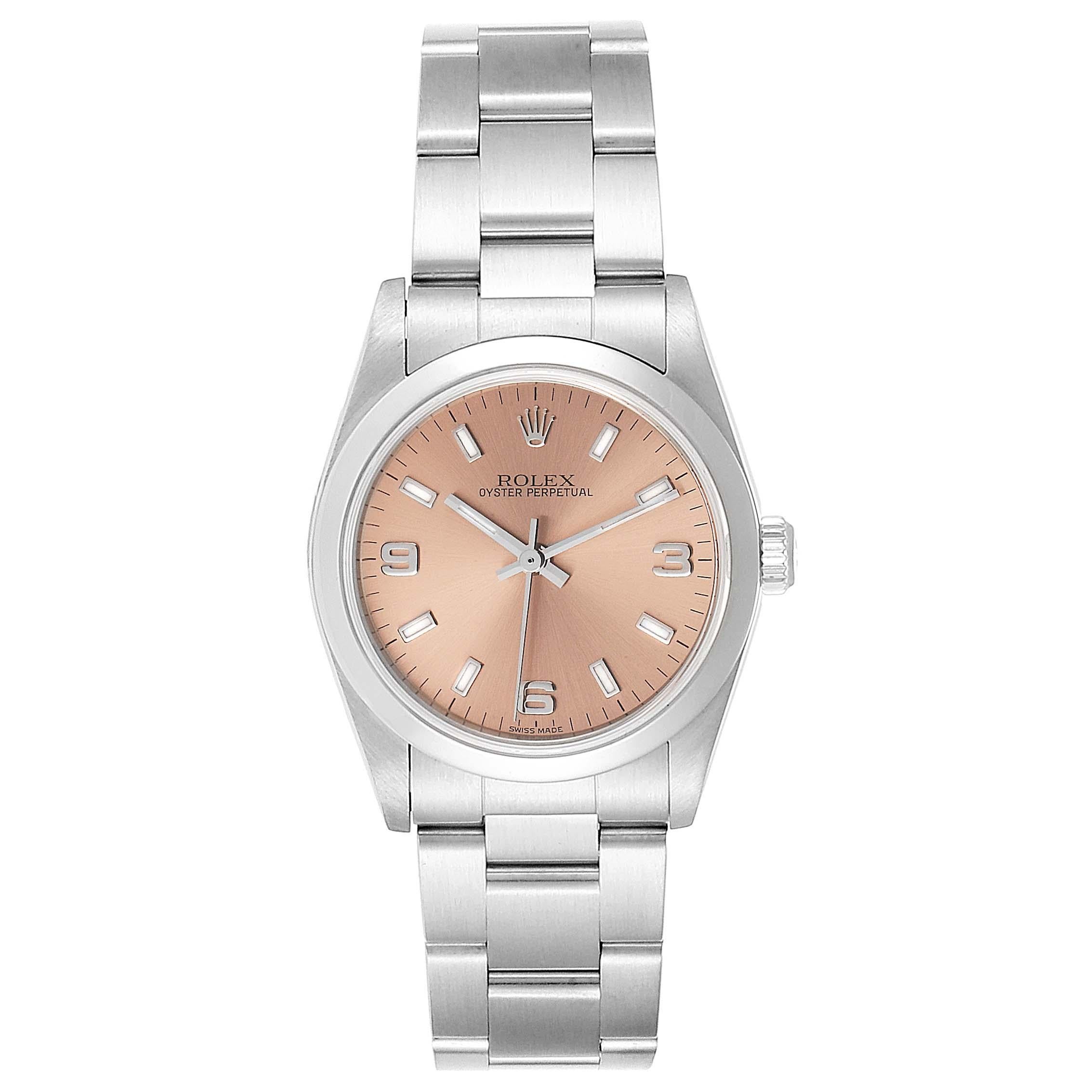 Rolex Midsize Salmon Dial Domed Bezel Steel Ladies Watch 77080. Officially certified chronometer self-winding movement. Stainless steel oyster case 31.0 mm in diameter. Rolex logo on a crown. Stainless steel smooth bezel. Scratch resistant sapphire