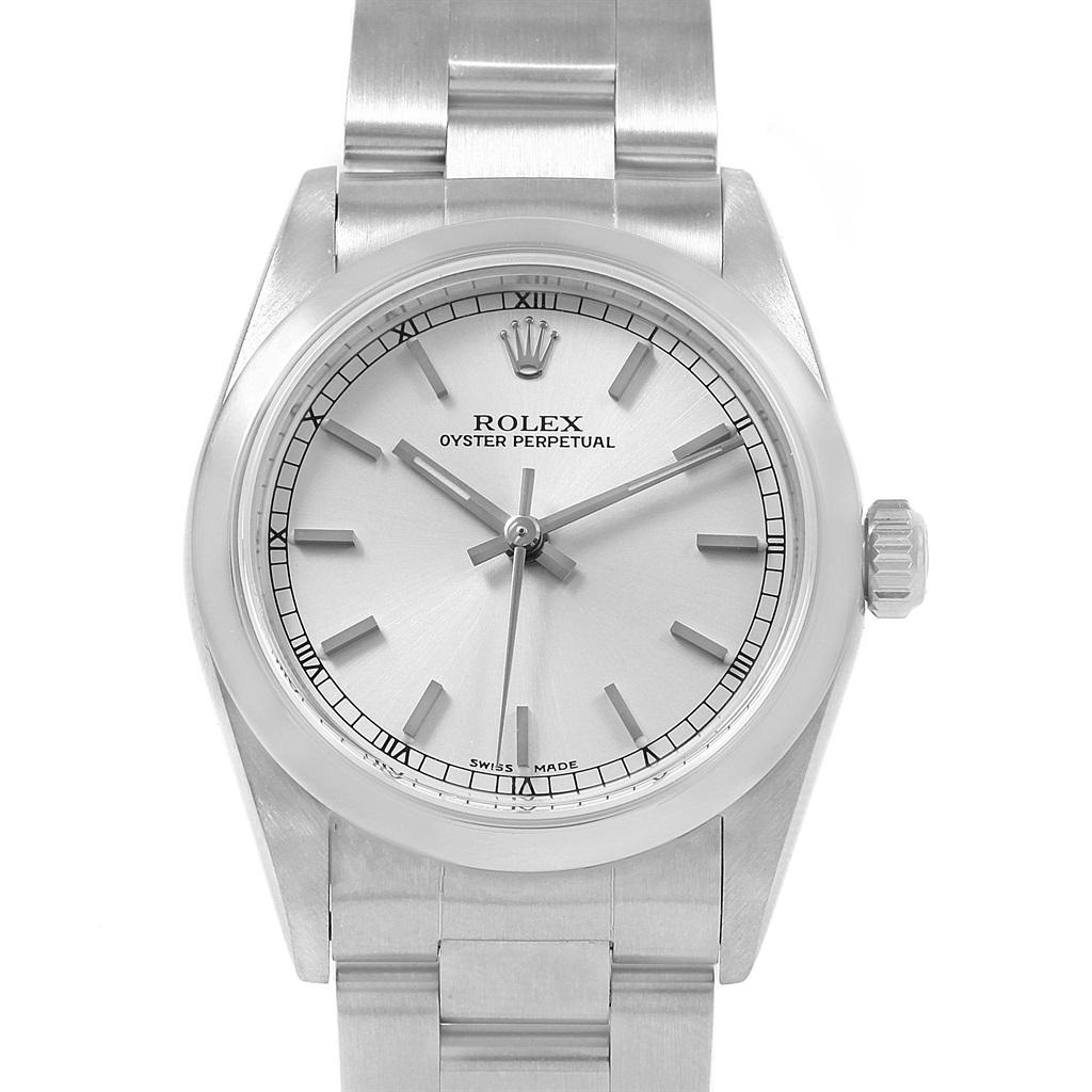 Rolex Midsize Silver Dial Smooth Bezel Steel Ladies Watch 77080. Officially certified chronometer self-winding movement. Stainless steel oyster case 31.0 mm in diameter. Rolex logo on a crown. Stainless steel smooth bezel. Scratch resistant sapphire