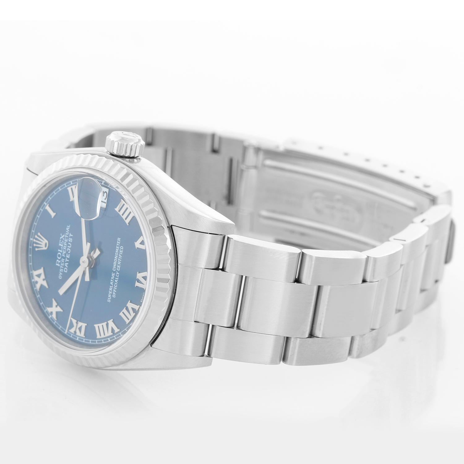 Rolex Midsize Stainless Steel Datejust Blue Dial Watch 78274 - Automatic winding; 31 jewel; sapphire crystal. Stainless steel case with 18k white gold fluted bezel (31mm diameter). Blue dial with steel Roman numerals. Stainless steel oyster