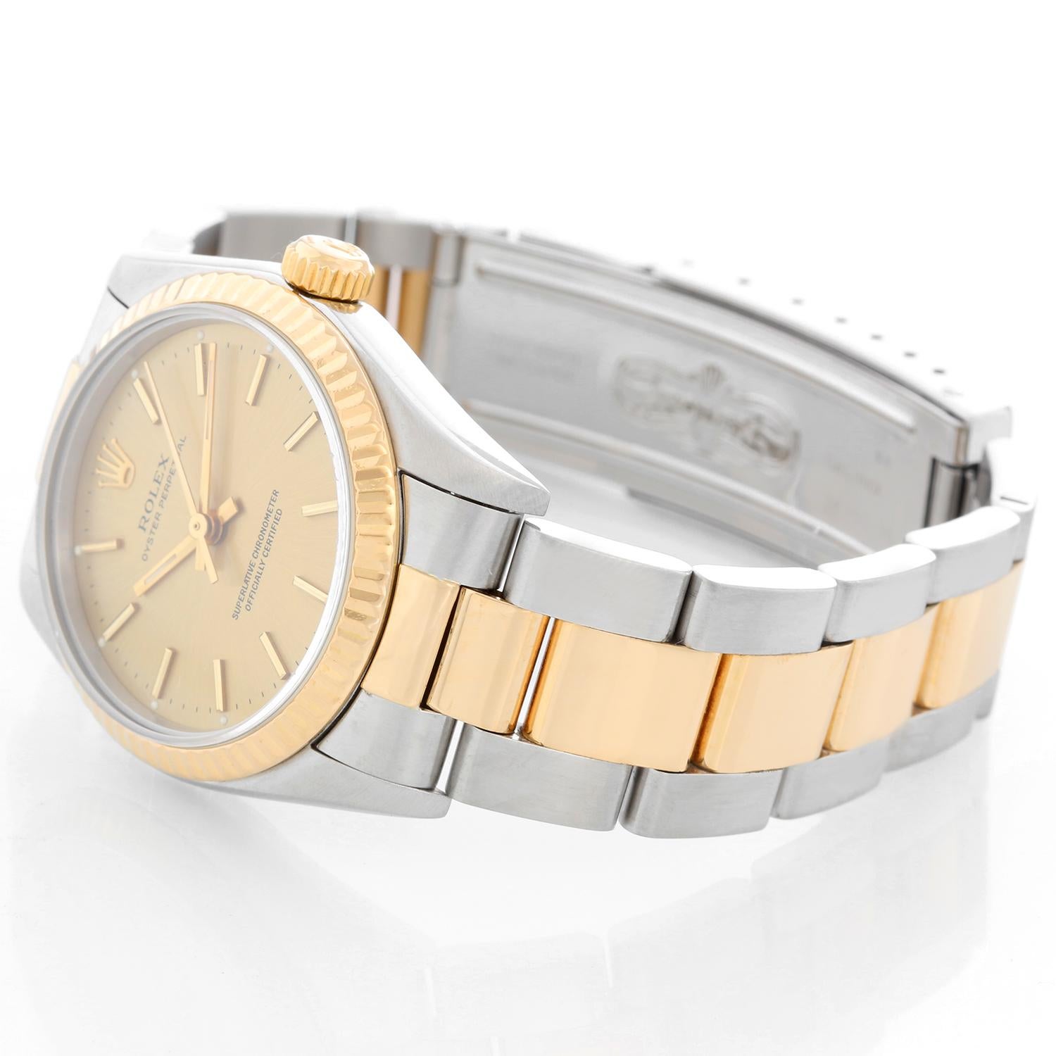 Rolex Midsize Steel & Gold 2 Tone Datejust 67513 - Automatic winding. Stainless steel case with 18k gold fluted bezel (30mm diameter). Champagne dial with stick hour markers . Stainless steel and 18k yellow gold Oyster bracelet. Pre-owned with