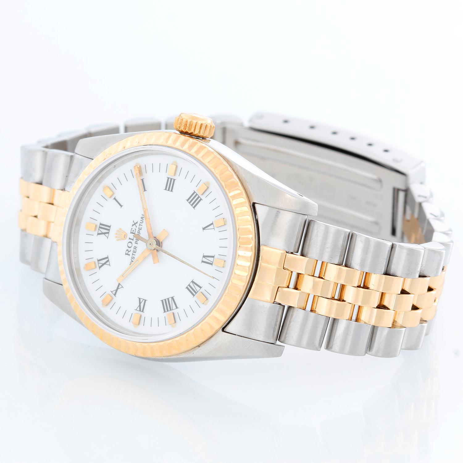 Rolex Midsize Steel & Gold 2 Tone Oyster Perpetual 67513 - Automatic winding. Stainless steel case with 18k gold fluted bezel (30mm diameter). White dial with painted black Roman numerals. Stainless steel and 18k yellow gold Jubilee bracelet.