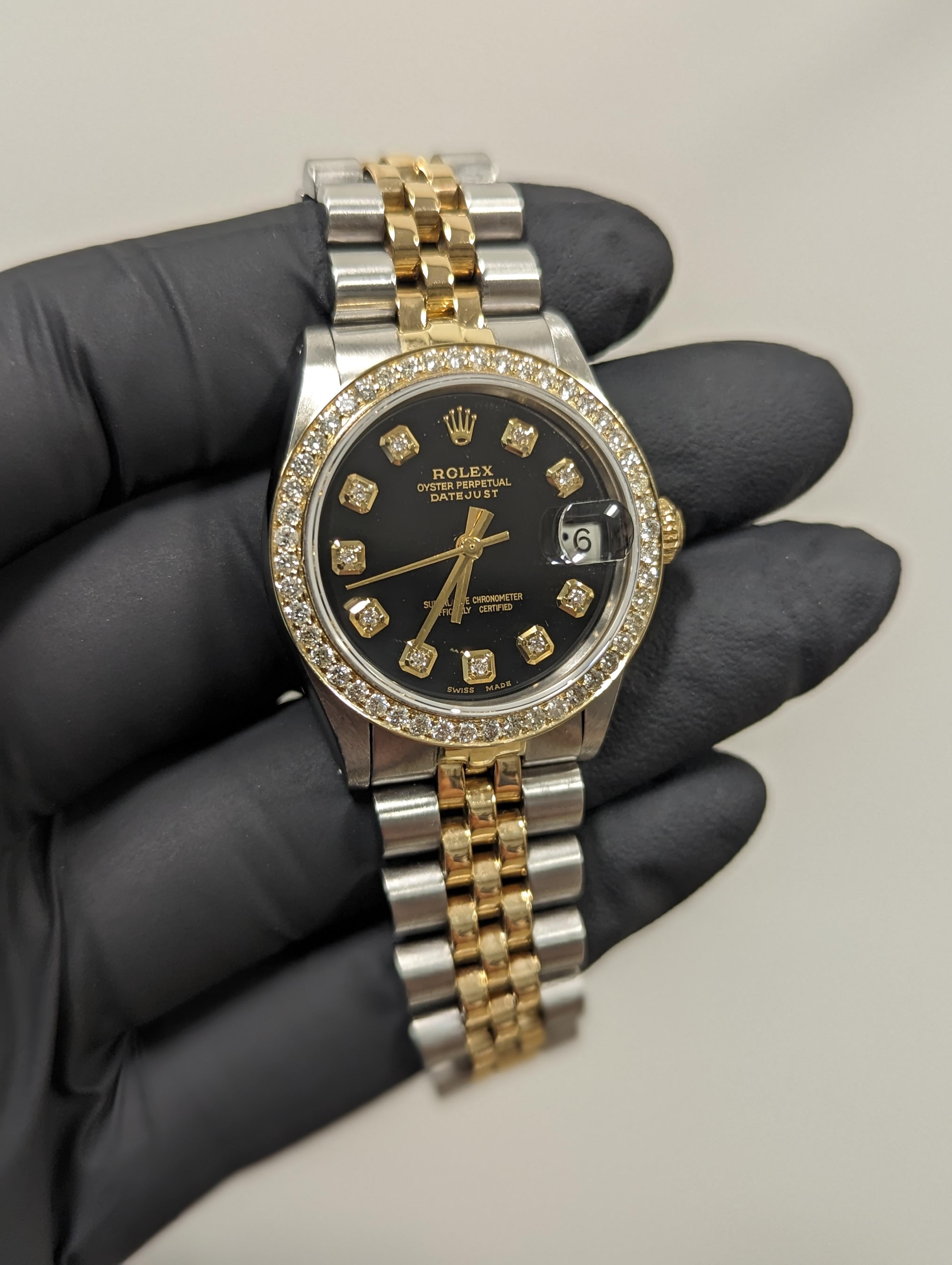 Swiss Wrist - SKU 6827-TT-BLK-DIA-AM-BDS-JBL

Brand : Rolex
Model : Datejust Ref# 6827 - Non-Quickset Model 
Gender : Unisex
Metals : 14K Yellow Gold/ Stainless Steel
Case Size : 31 mm
Dial : Custom Black Diamond Dial (This dial is not original
