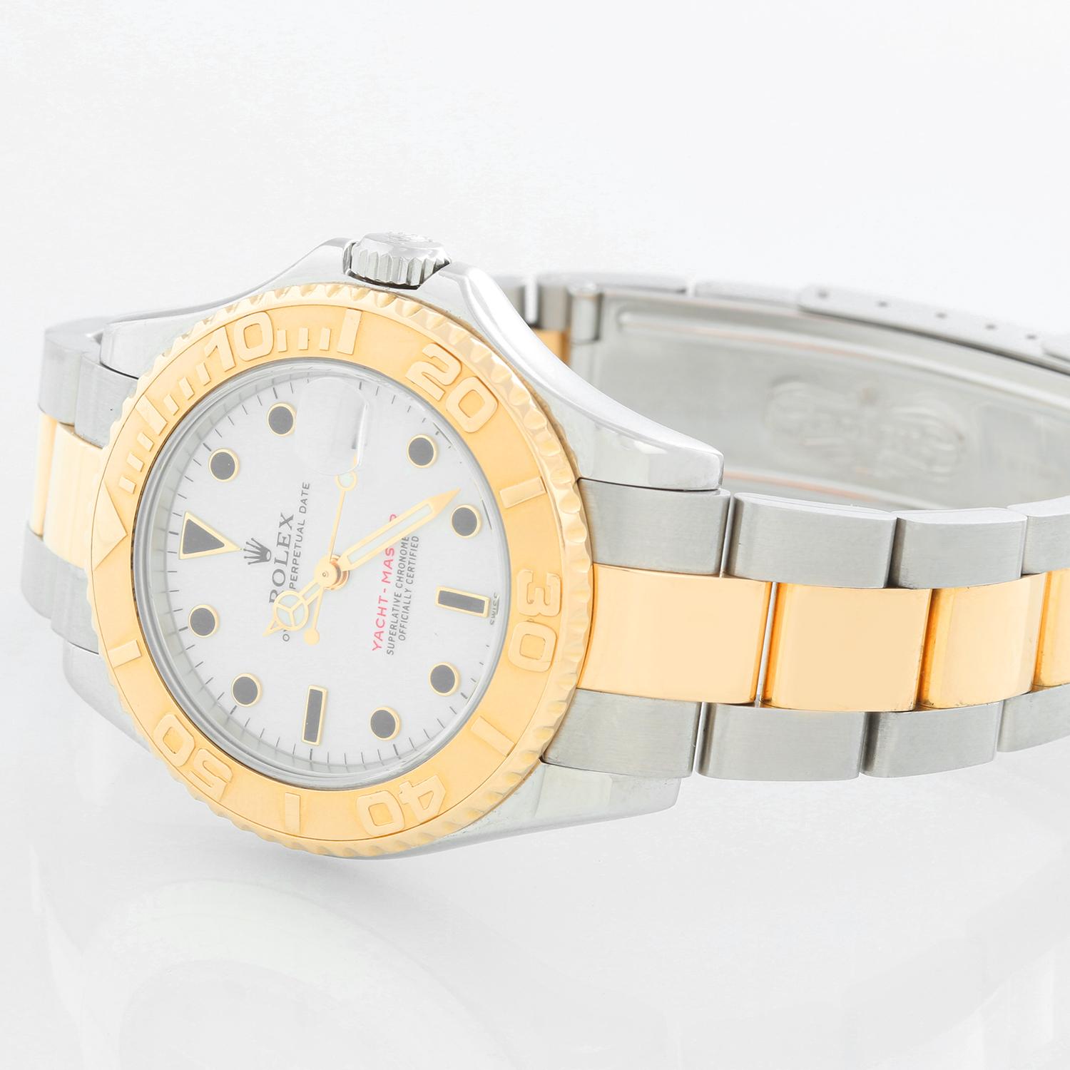 Rolex Midsize Yacht-Master  35mm Steel & Gold Men's or Ladies Watch 168623 - Automatic winding; sapphire crystal. Stainless steel case with 18k yellow gold bezel . White dial with black hour markers. Stainless steel and 18k yellow gold Oyster