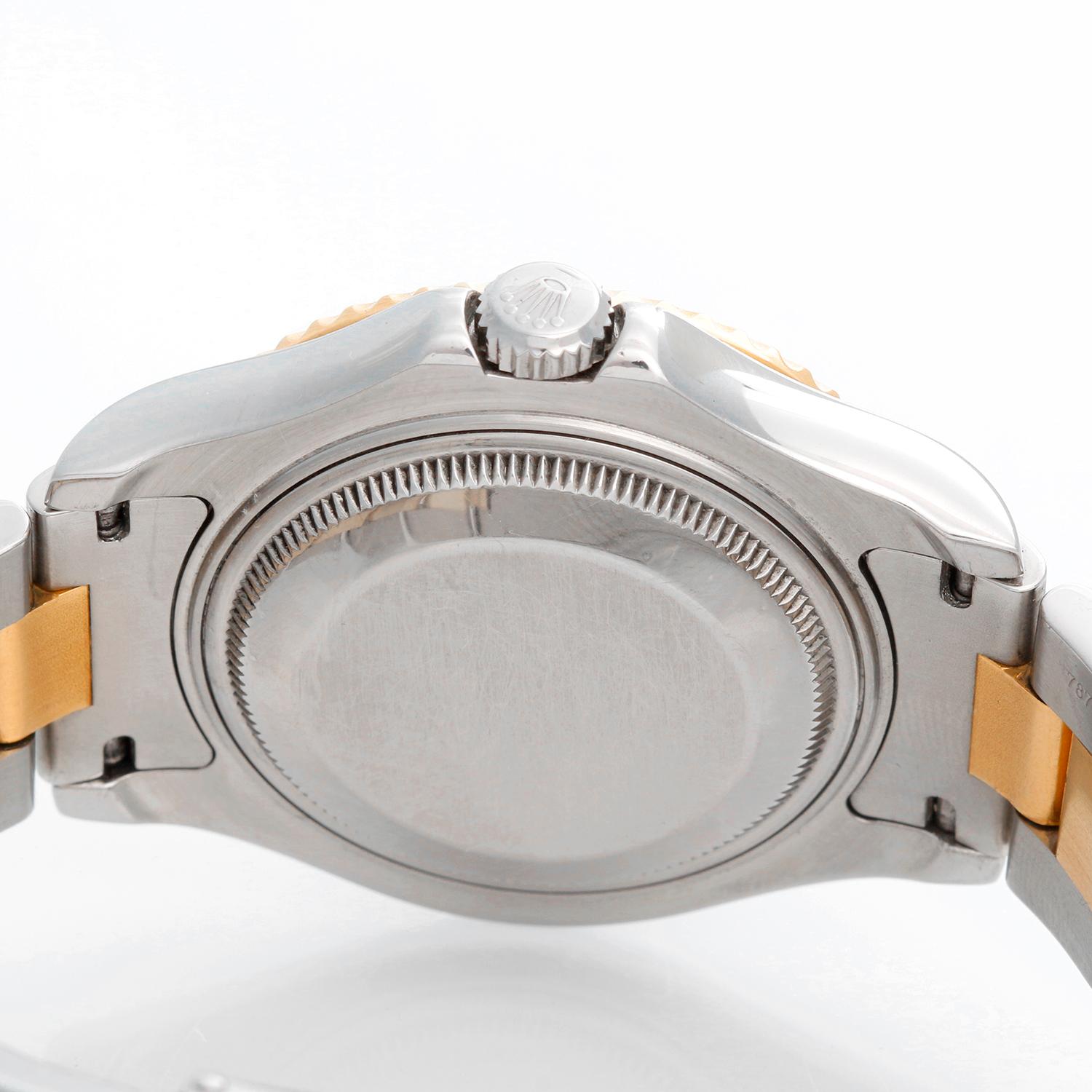 Rolex Midsize Yacht-Master  35mm Steel & Gold Men's or Ladies Watch 168623 - Automatic winding; sapphire crystal. Stainless steel case with 18k yellow gold bezel . Blue dial with hour markers. Stainless steel and 18k yellow gold Oyster bracelet with