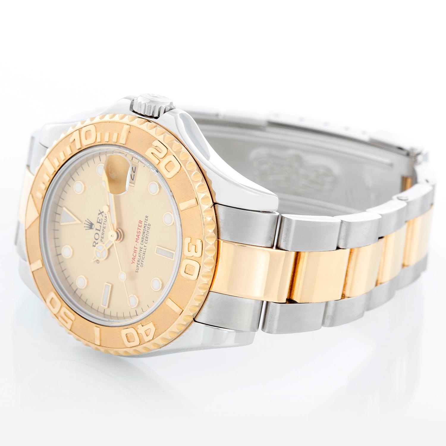 Rolex Midsize Yacht-Master 35mm Steel & Gold Men's or Ladies Watch 168623 - Automatic winding; sapphire crystal. Stainless steel case with 18k yellow gold bezel . Champagne dial. Stainless steel and 18k yellow gold Oyster bracelet with flip-lock
